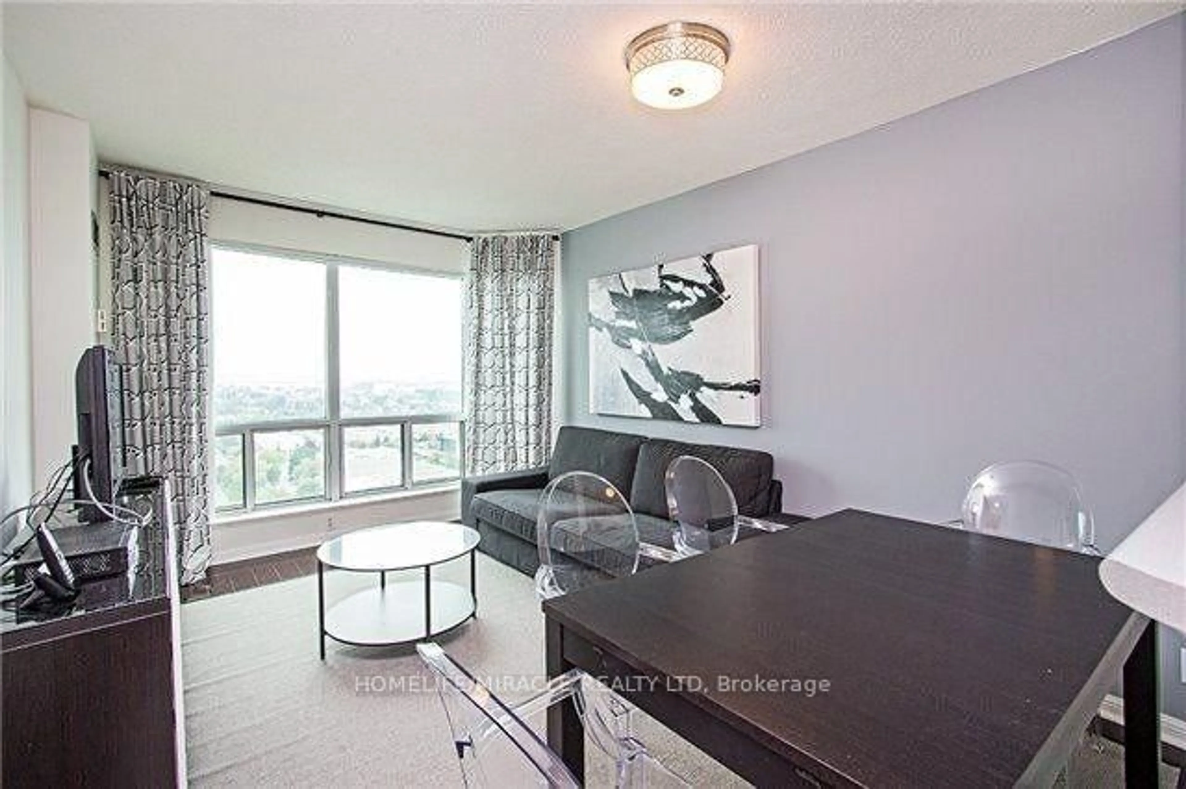 Living room with furniture, wood/laminate floor for 11 Lee Centre Dr #2305, Toronto Ontario M1H 3J5