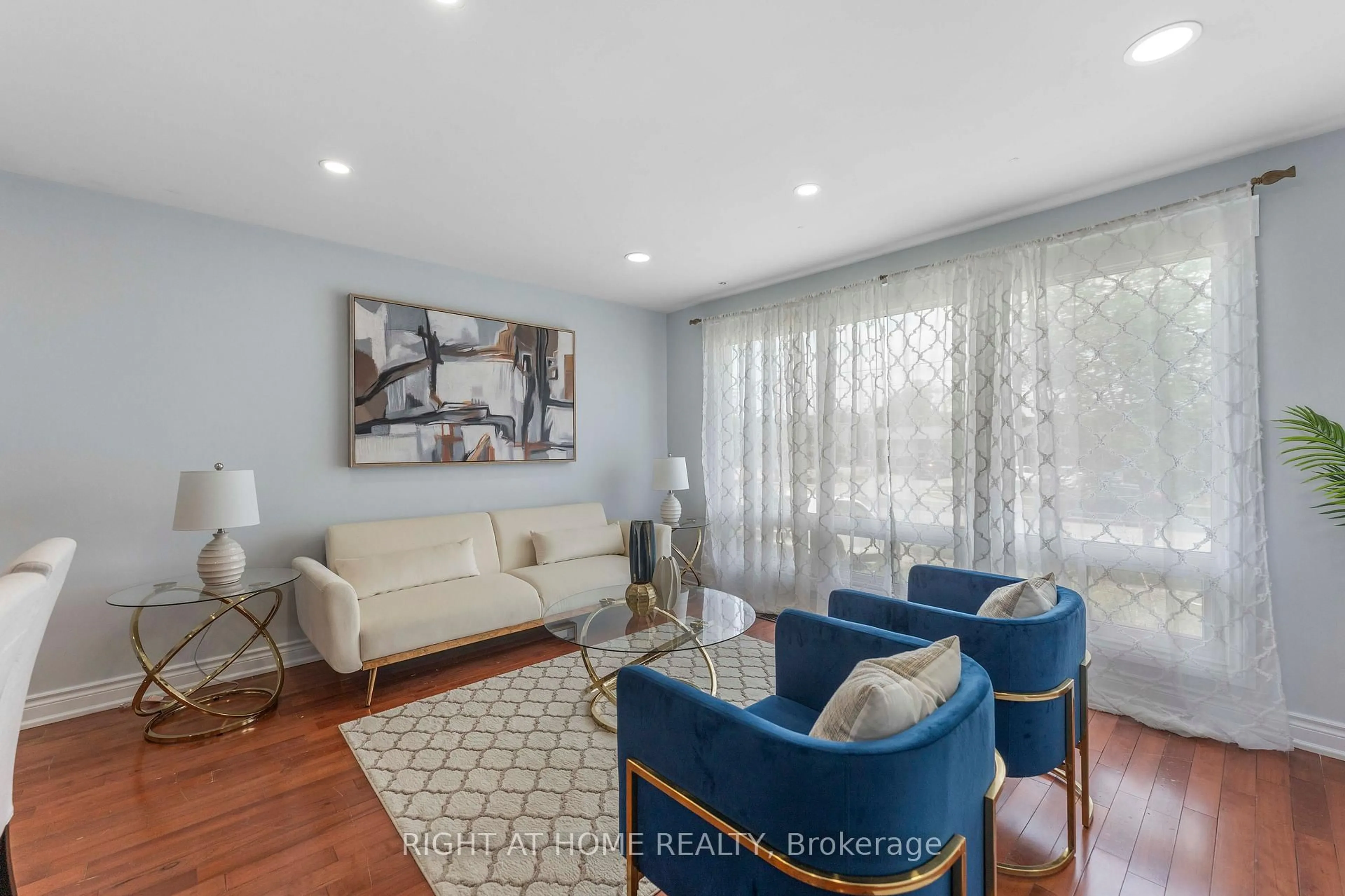 Living room with furniture, wood/laminate floor for 608 Mccowan Rd, Toronto Ontario M1J 1K1