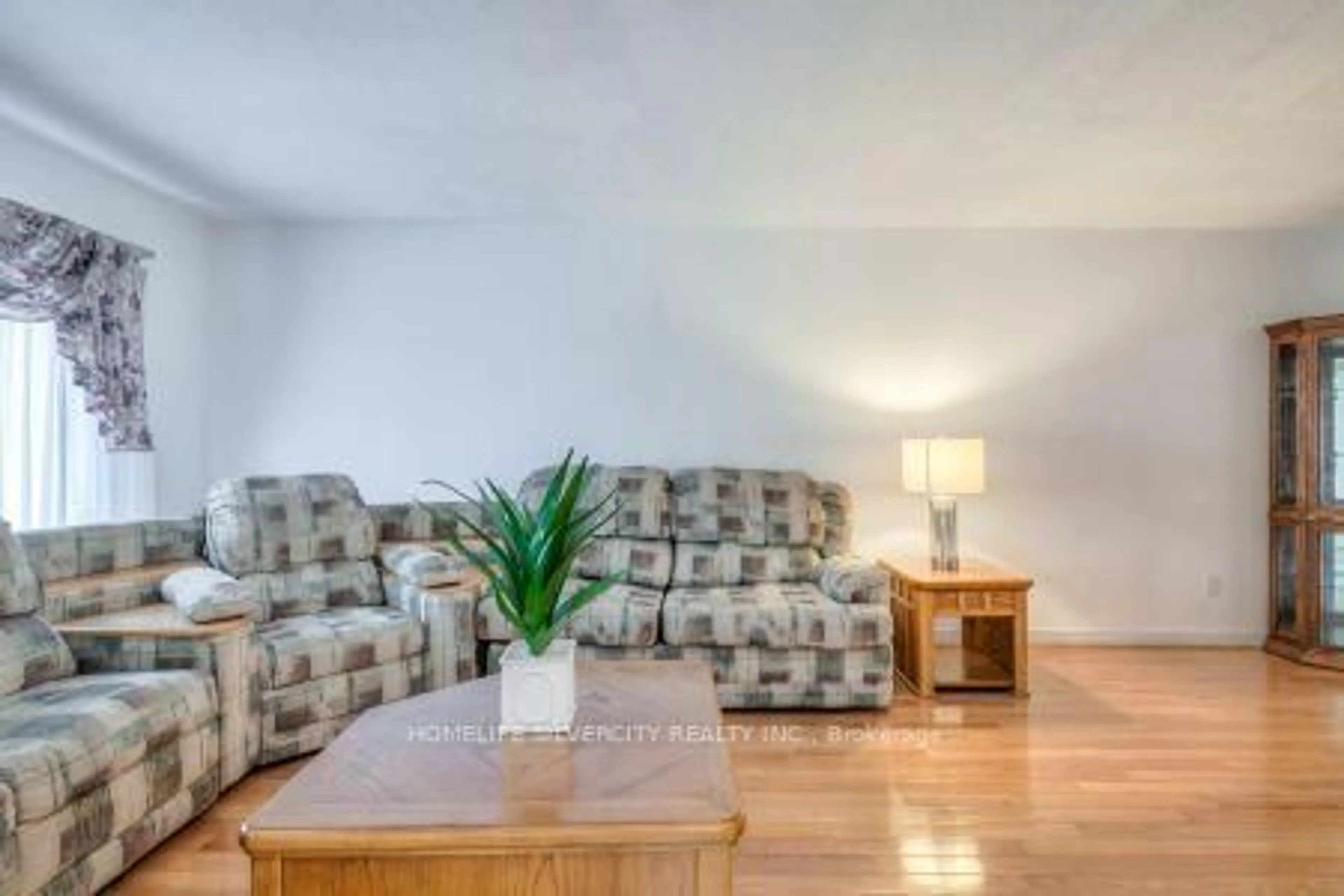 Living room with furniture, wood/laminate floor for 5 Braebrook Dr, Whitby Ontario L1R 1V2