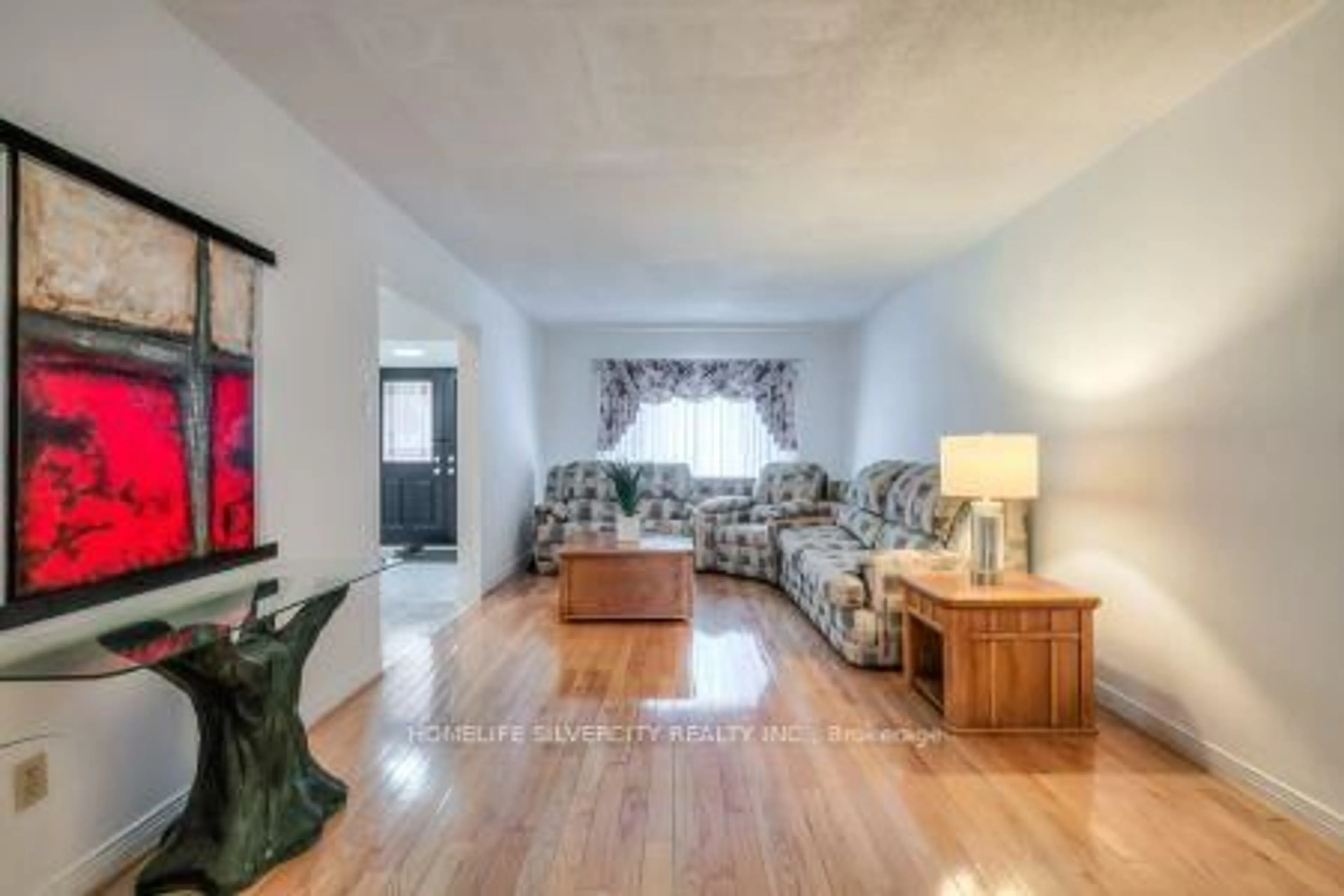 Living room with furniture, wood/laminate floor for 5 Braebrook Dr, Whitby Ontario L1R 1V2