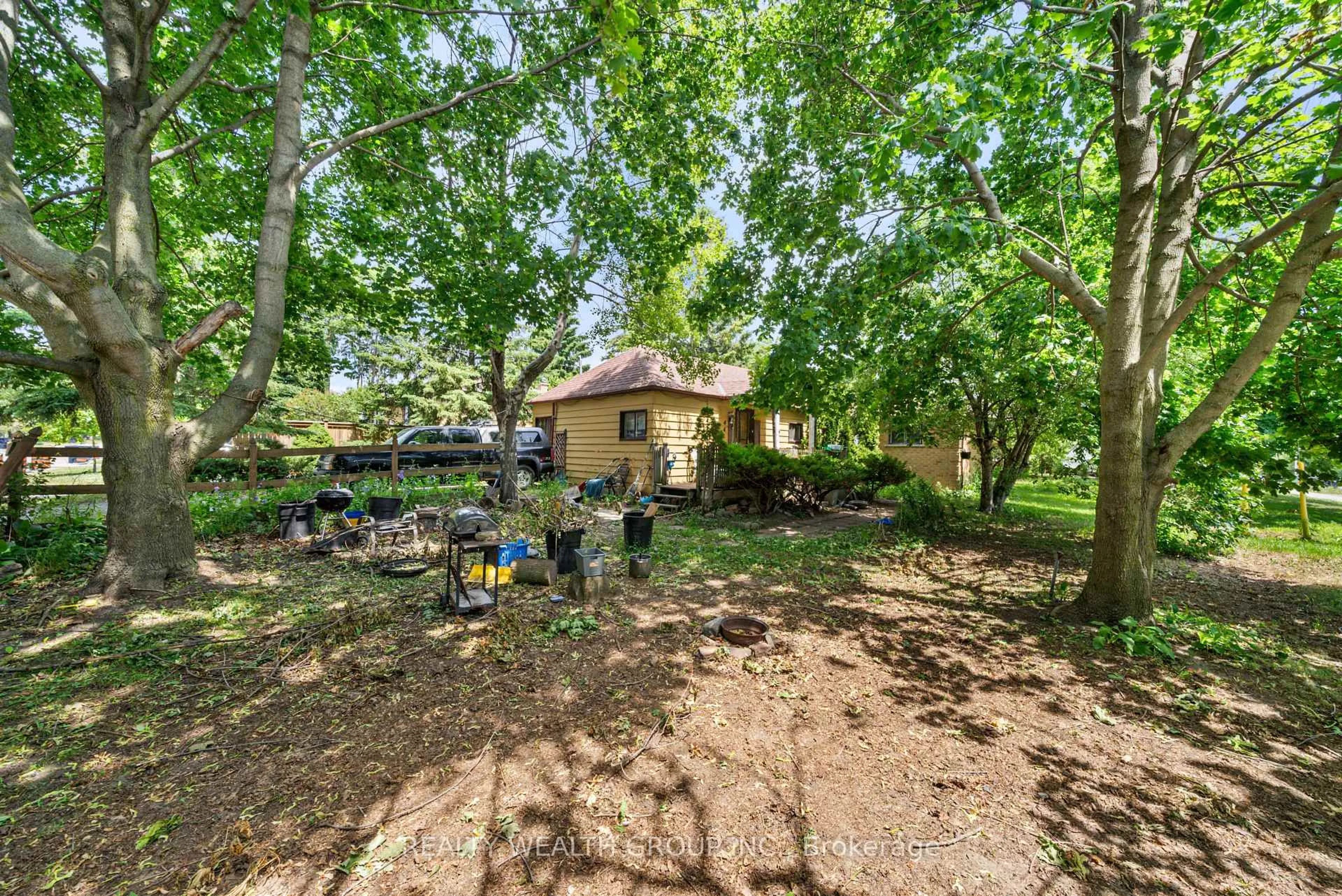 A pic from outside/outdoor area/front of a property/back of a property/a pic from drone, forest/trees view for 4450 Lawrence Ave, Toronto Ontario M1E 2T9