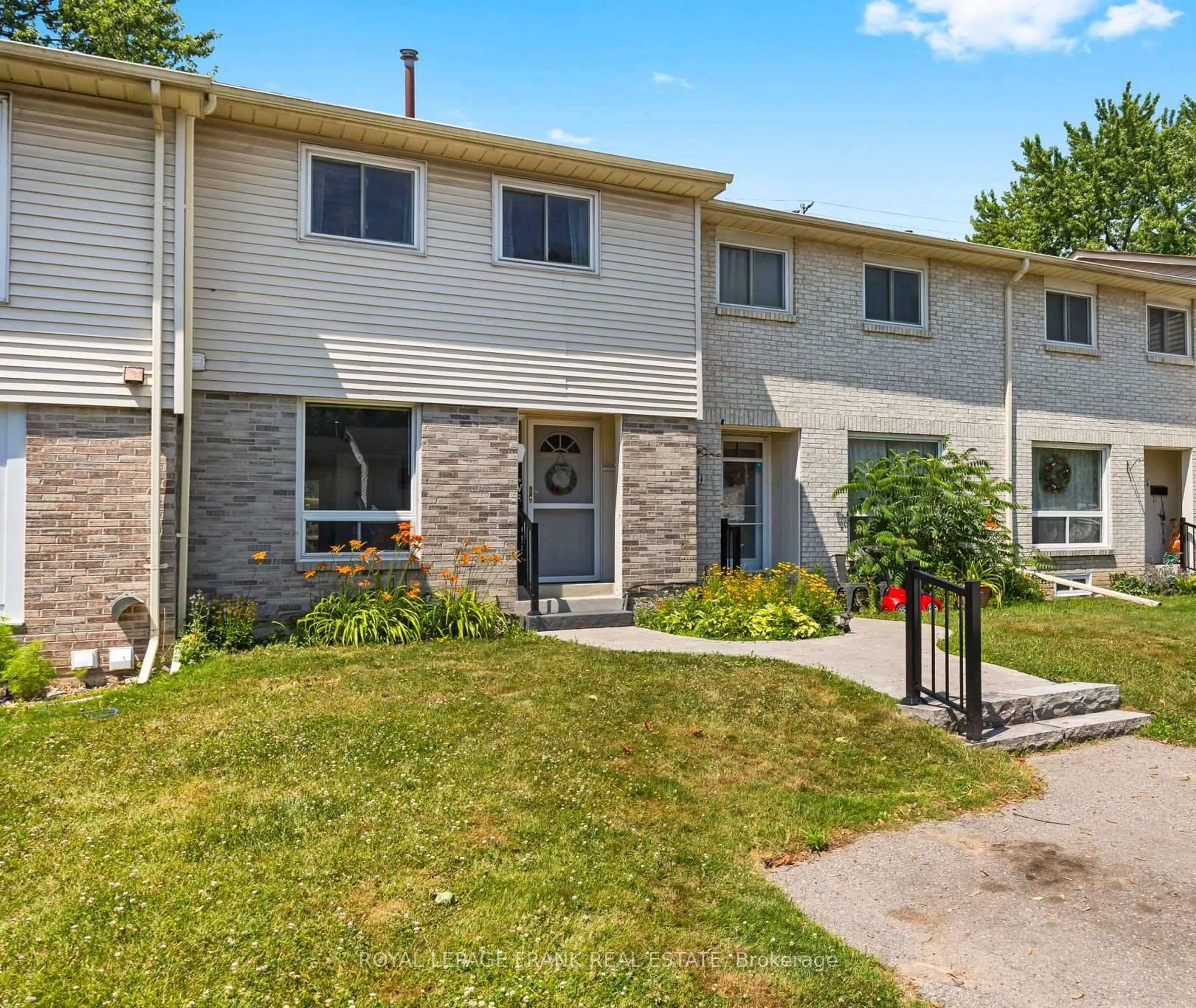 Home with vinyl exterior material, street for 611 Galahad Dr #32, Oshawa Ontario L1K 1M1