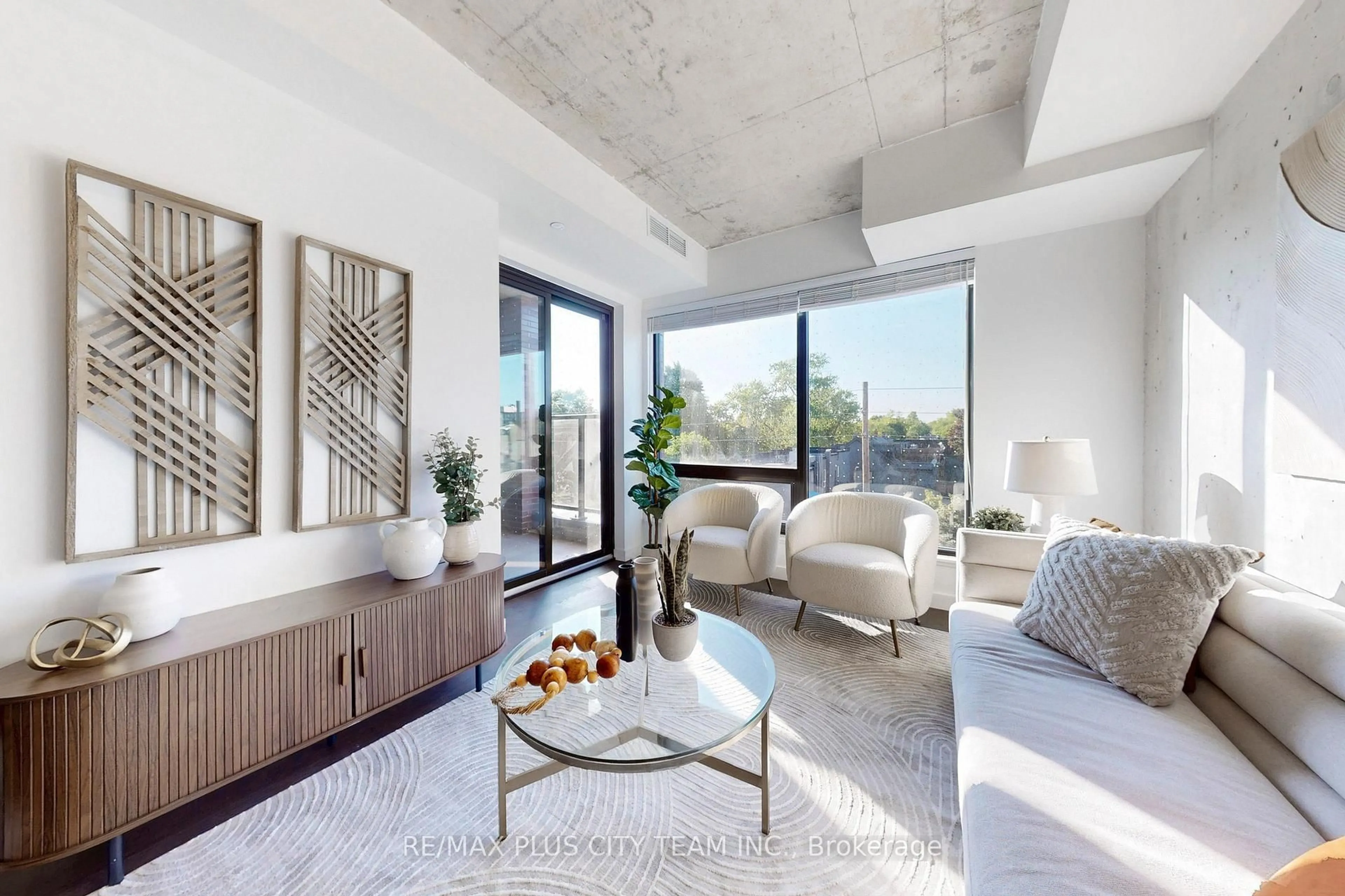 Living room with furniture, cement floor for 246 Logan Ave #412, Toronto Ontario M4M 0E9