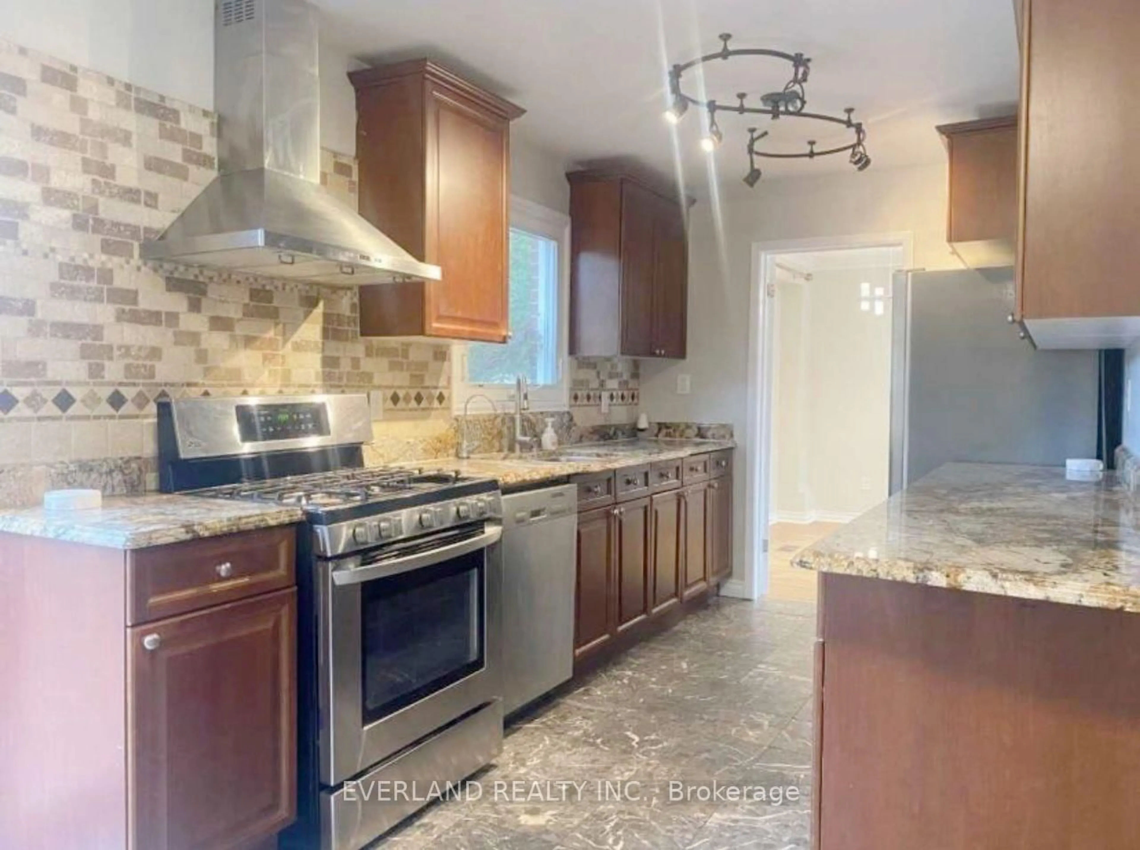 Open concept kitchen, ceramic/tile floor for 573 Huntingwood Dr, Toronto Ontario M1W 1G9
