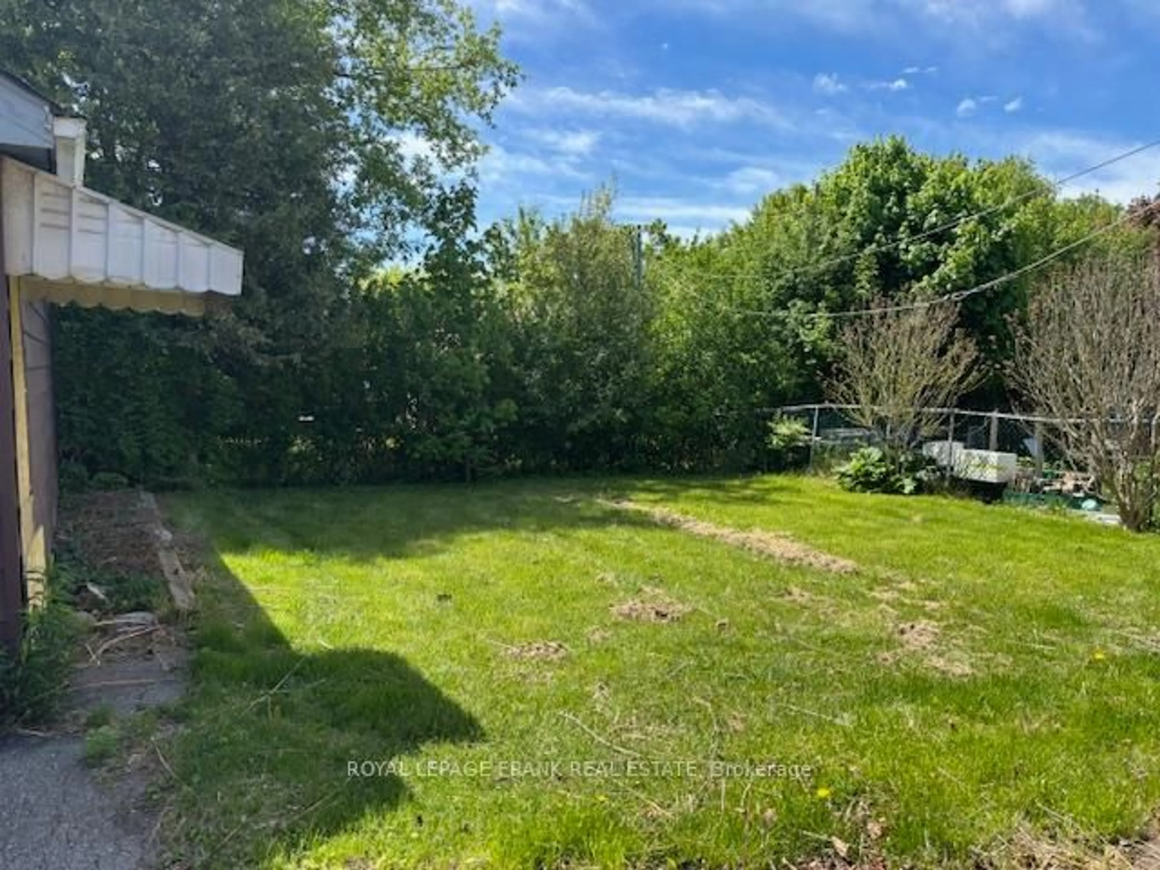 A pic from outside/outdoor area/front of a property/back of a property/a pic from drone, forest/trees view for 213 Banting Ave, Oshawa Ontario L1H 2M8