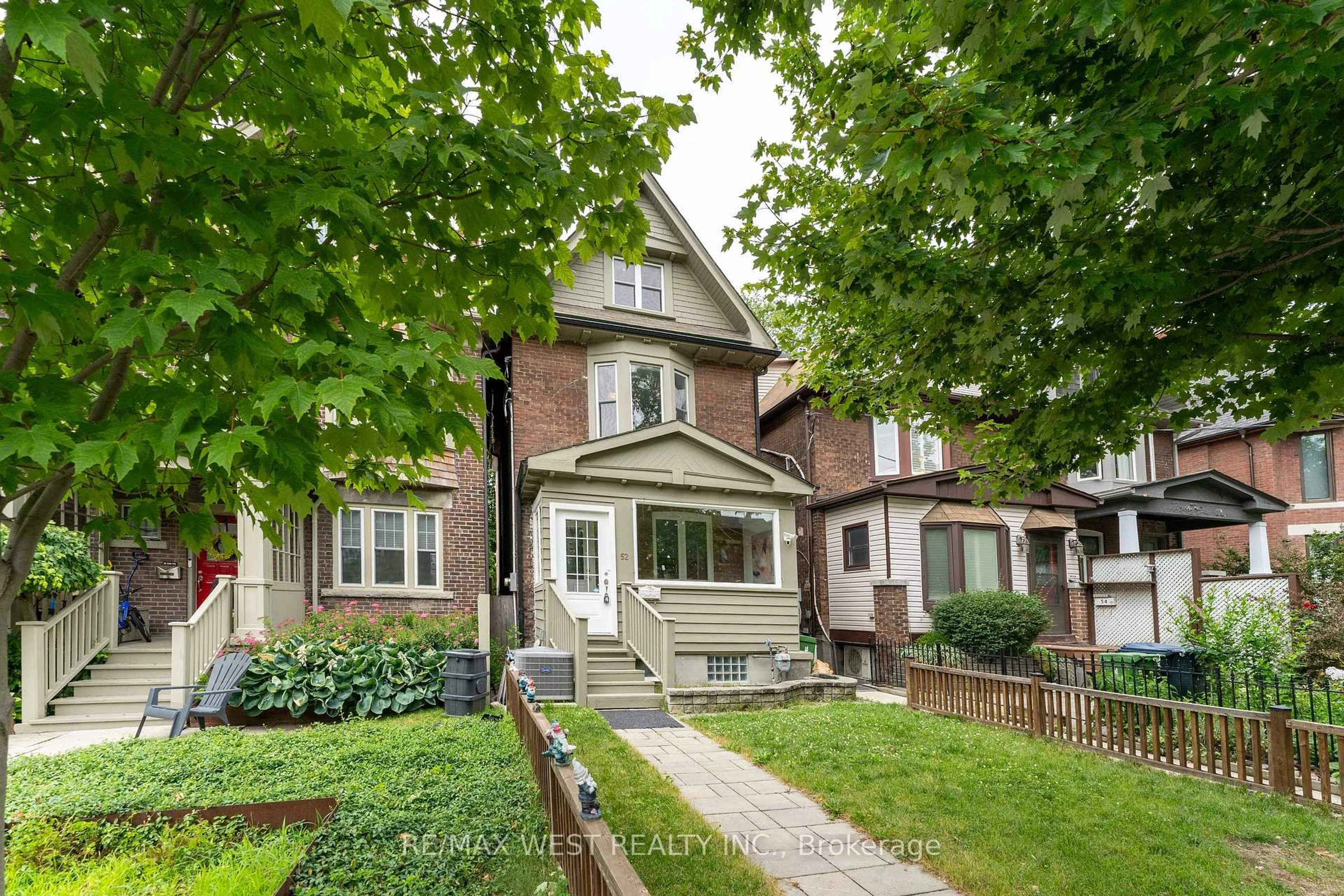 Home with brick exterior material, street for 52 Woodycrest Ave, Toronto Ontario M4J 3A7