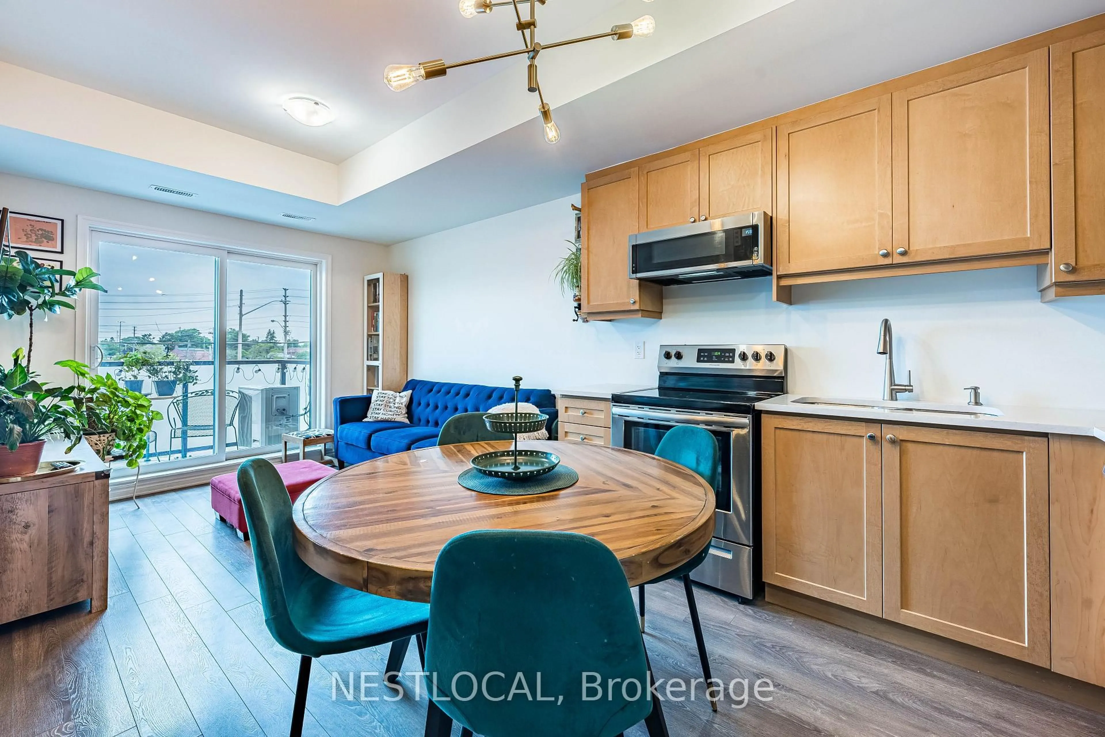 Open concept kitchen, wood/laminate floor for 1085 Danforth Rd #206, Toronto Ontario M1J 0B2
