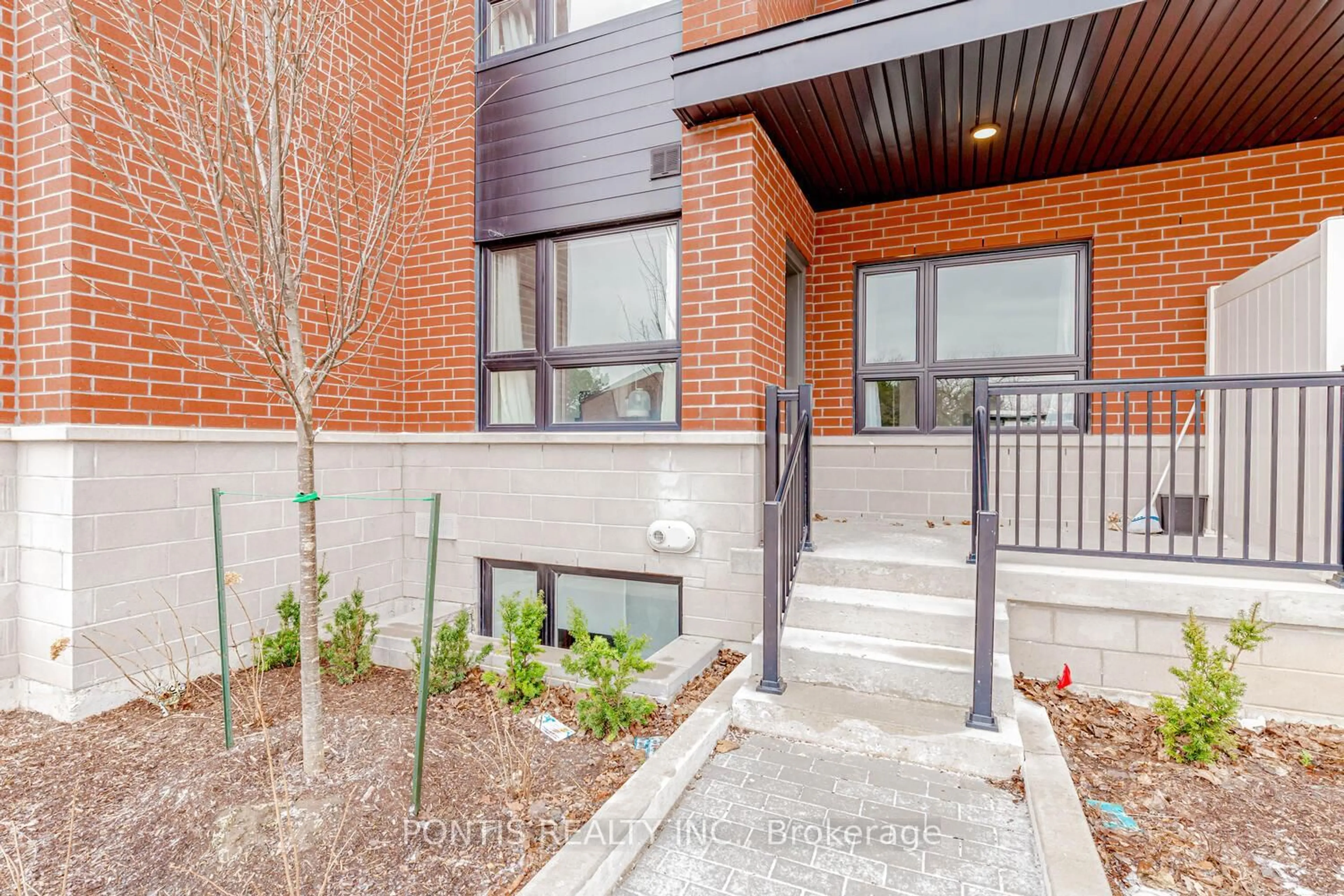 Home with brick exterior material, street for 2100 Bridletowne Circ #102, Toronto Ontario M1W 0A6