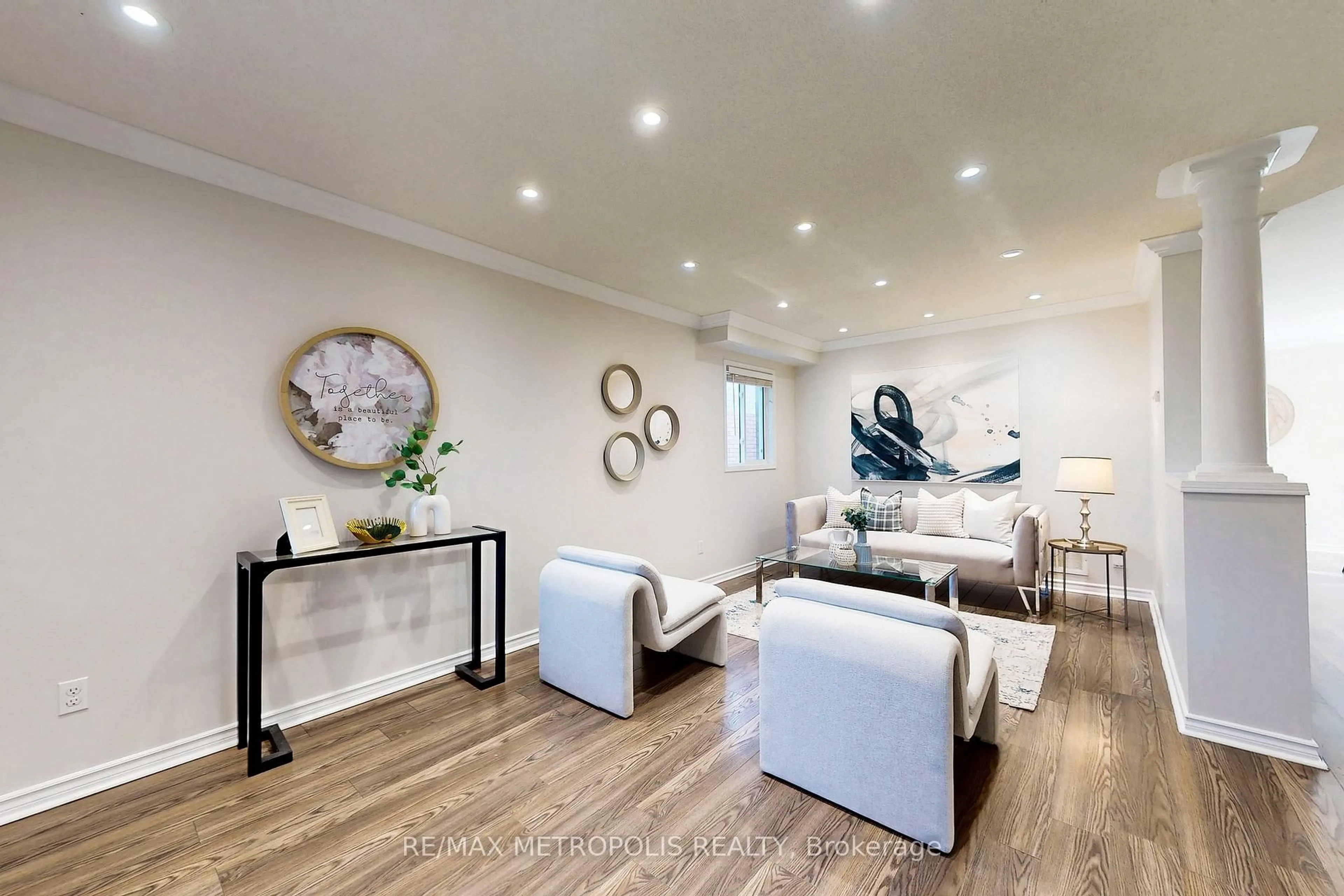 Living room with furniture, wood/laminate floor for 187 Wilkins Cres, Clarington Ontario L1E 3B7