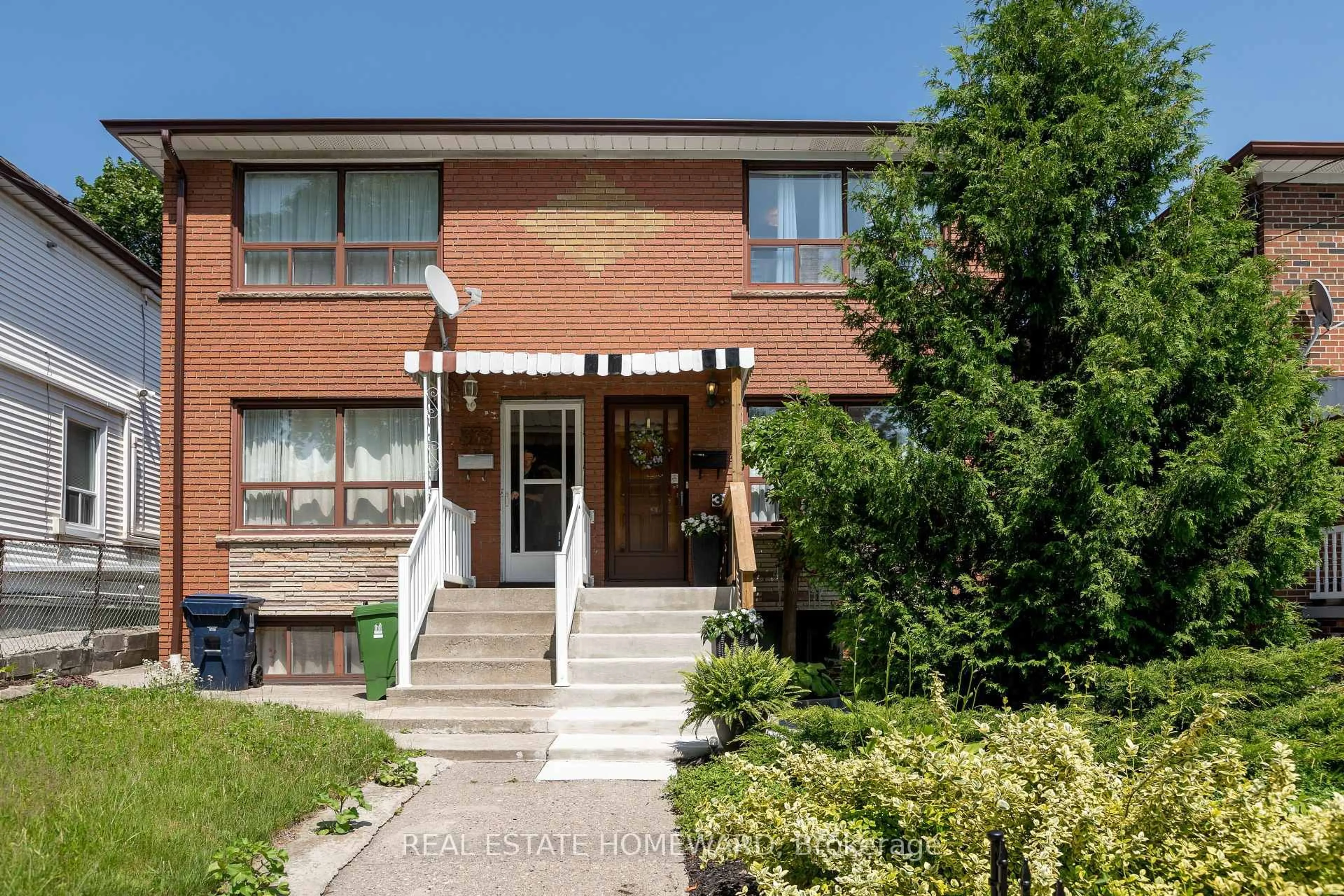 Home with brick exterior material, street for 331 Rhodes Ave, Toronto Ontario M4L 3A4