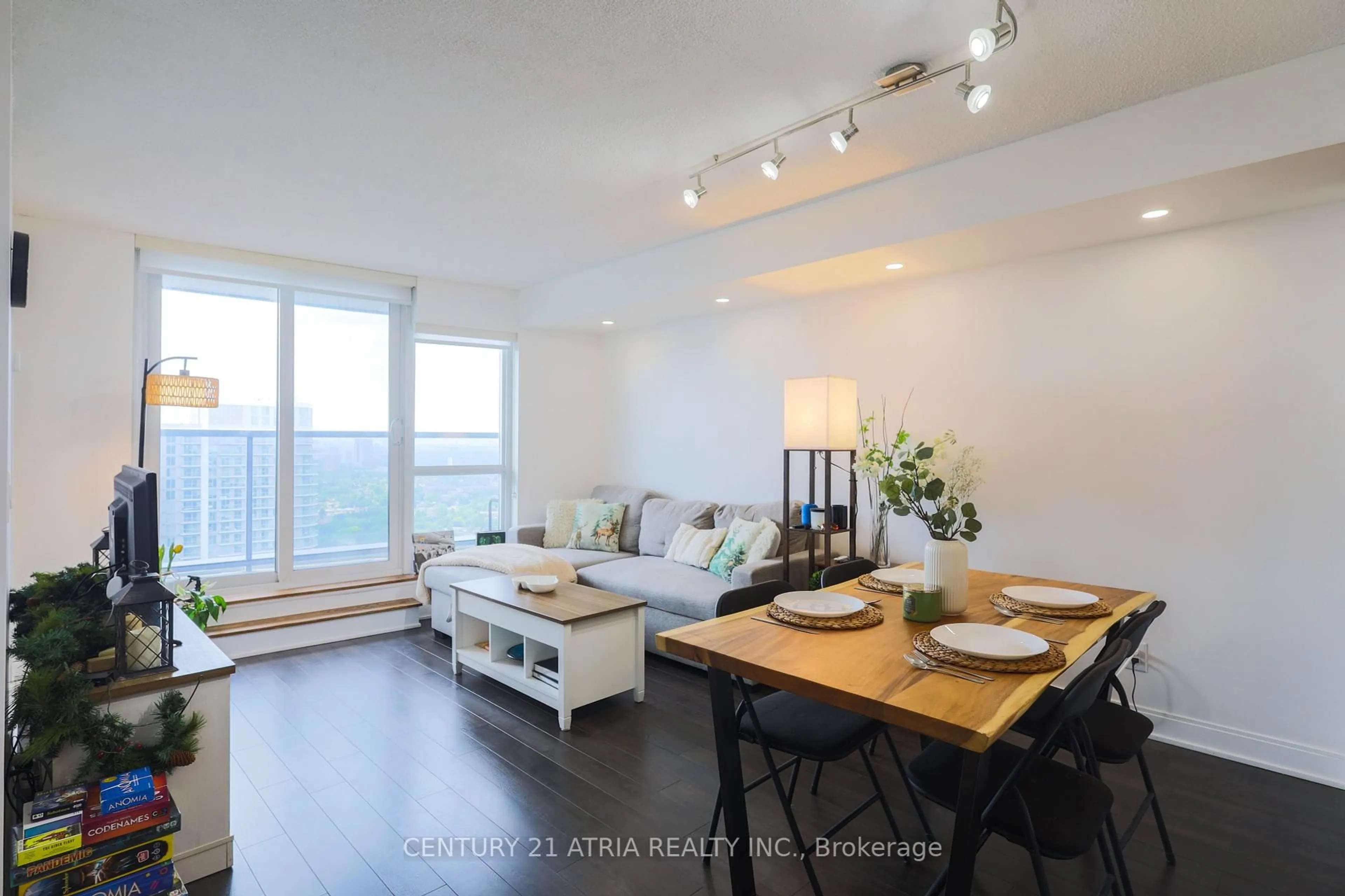 Living room with furniture, wood/laminate floor for 125 Village Green Sq #3707, Toronto Ontario M1S 0G3