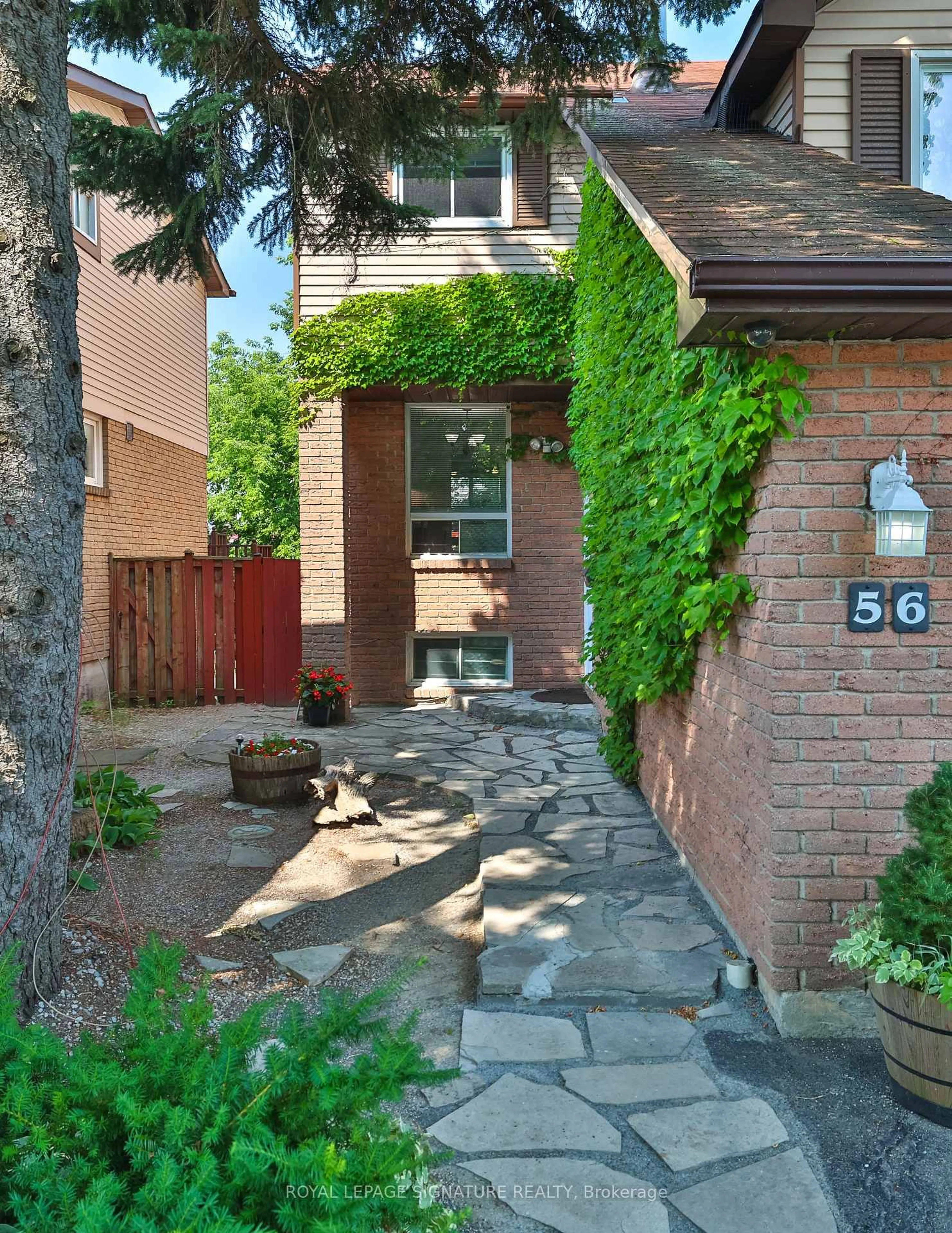 Home with brick exterior material, street for 56 Muirlands Dr, Toronto Ontario M1V 2B4