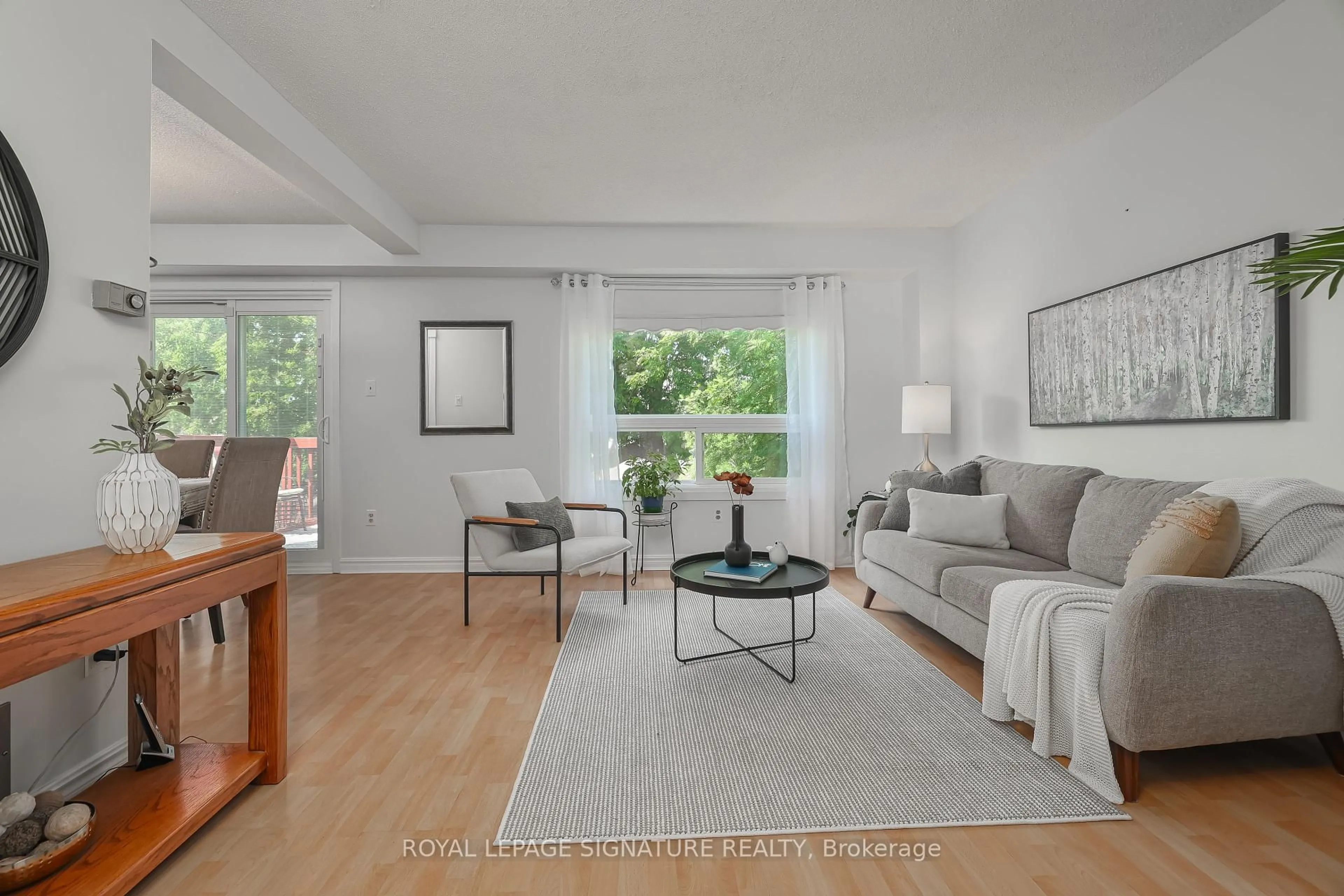 Living room with furniture, wood/laminate floor for 56 Muirlands Dr, Toronto Ontario M1V 2B4