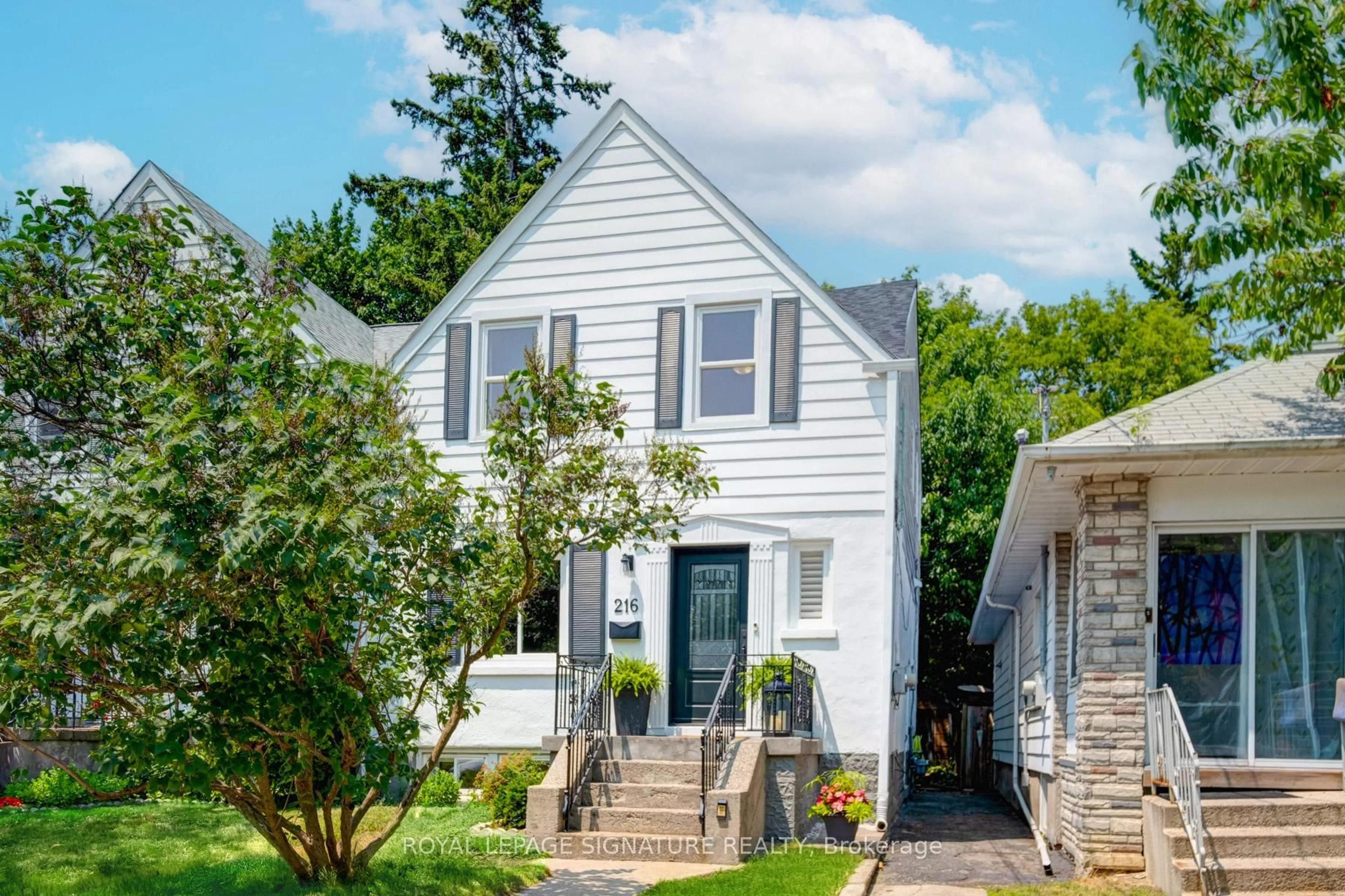 Home with vinyl exterior material, street for 216 Holborne Ave, Toronto Ontario M4C 2R9