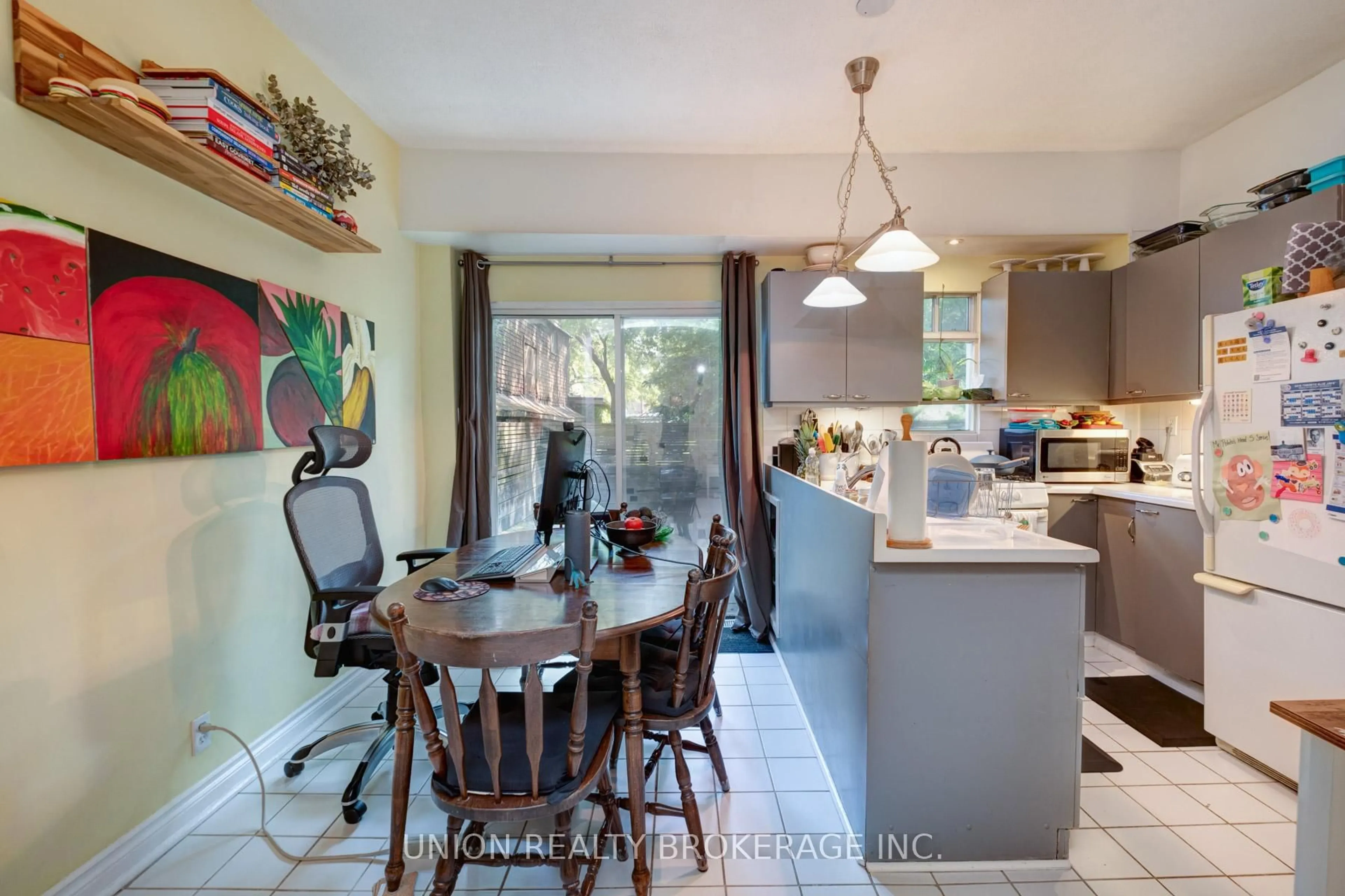 Open concept kitchen, ceramic/tile floor for 211 De Grassi St, Toronto Ontario M4M 2K8