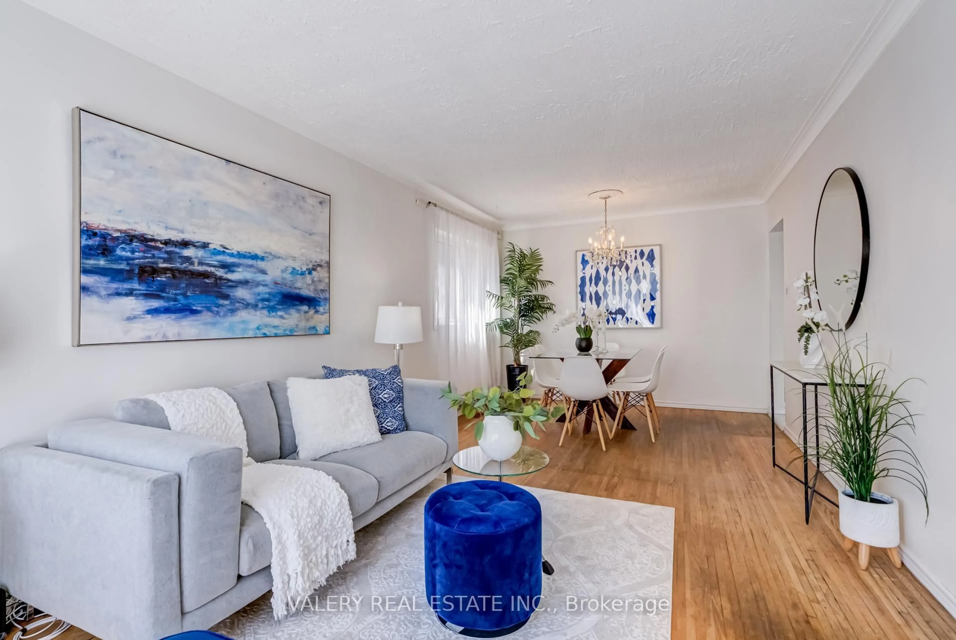 Living room with furniture, wood/laminate floor for 119 Marble Arch Cres, Toronto Ontario M1R 1W8