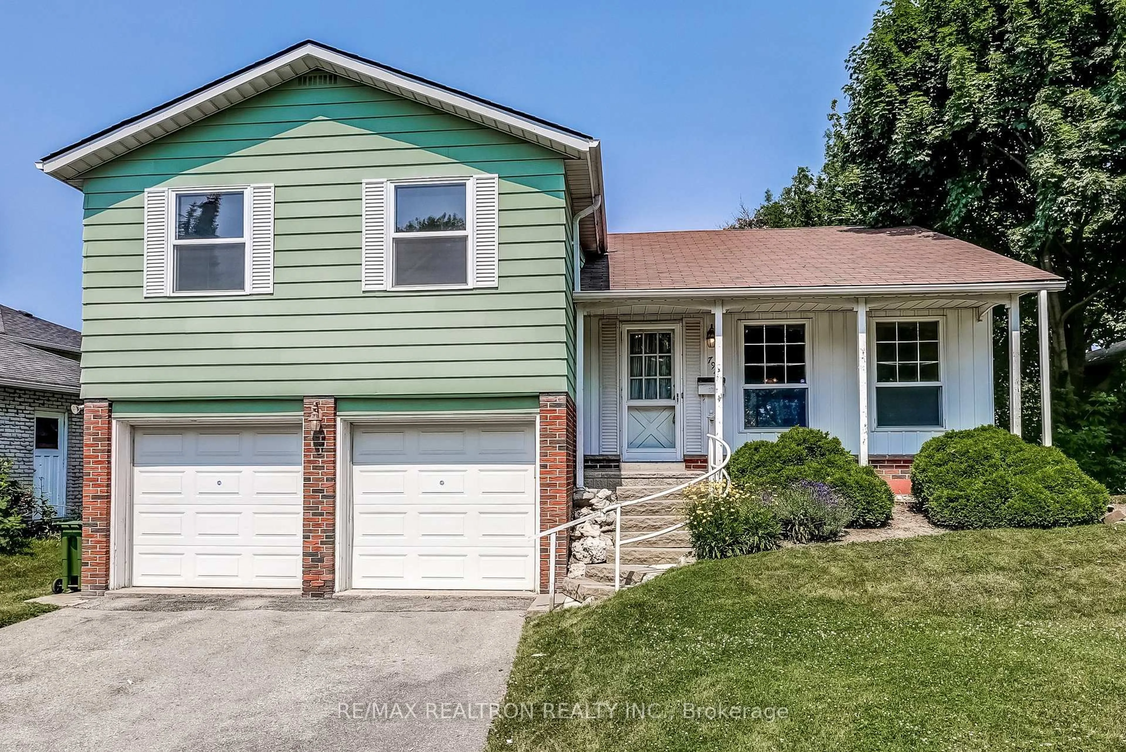 Home with vinyl exterior material, street for 794 Huntingwood Dr, Toronto Ontario M1T 2L6