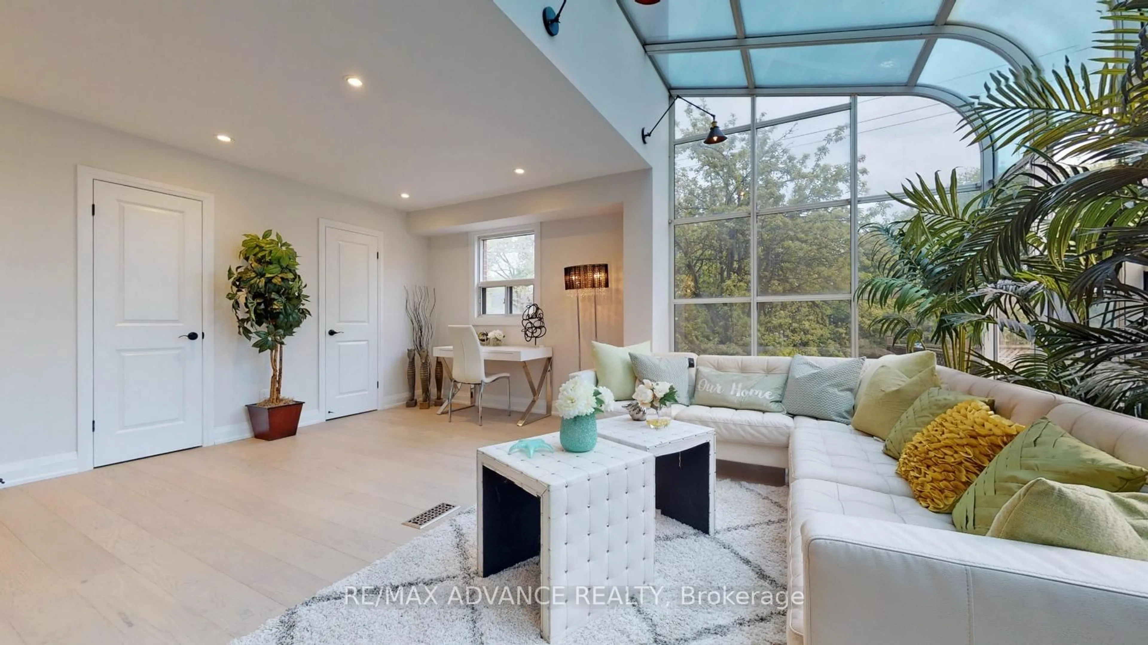 Living room with furniture, ceramic/tile floor for 108 Eaton Ave, Toronto Ontario M4J 2Z7