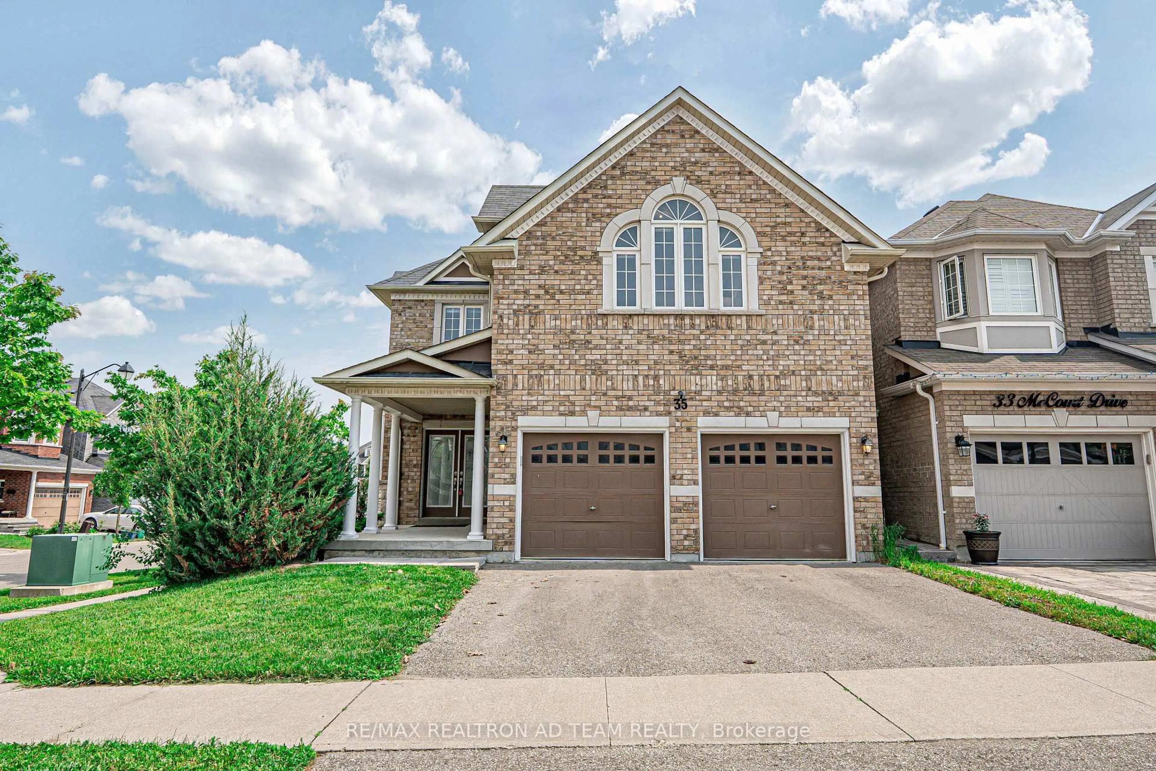 Home with brick exterior material, street for 35 Mccourt Dr, Ajax Ontario L1Z 0P1