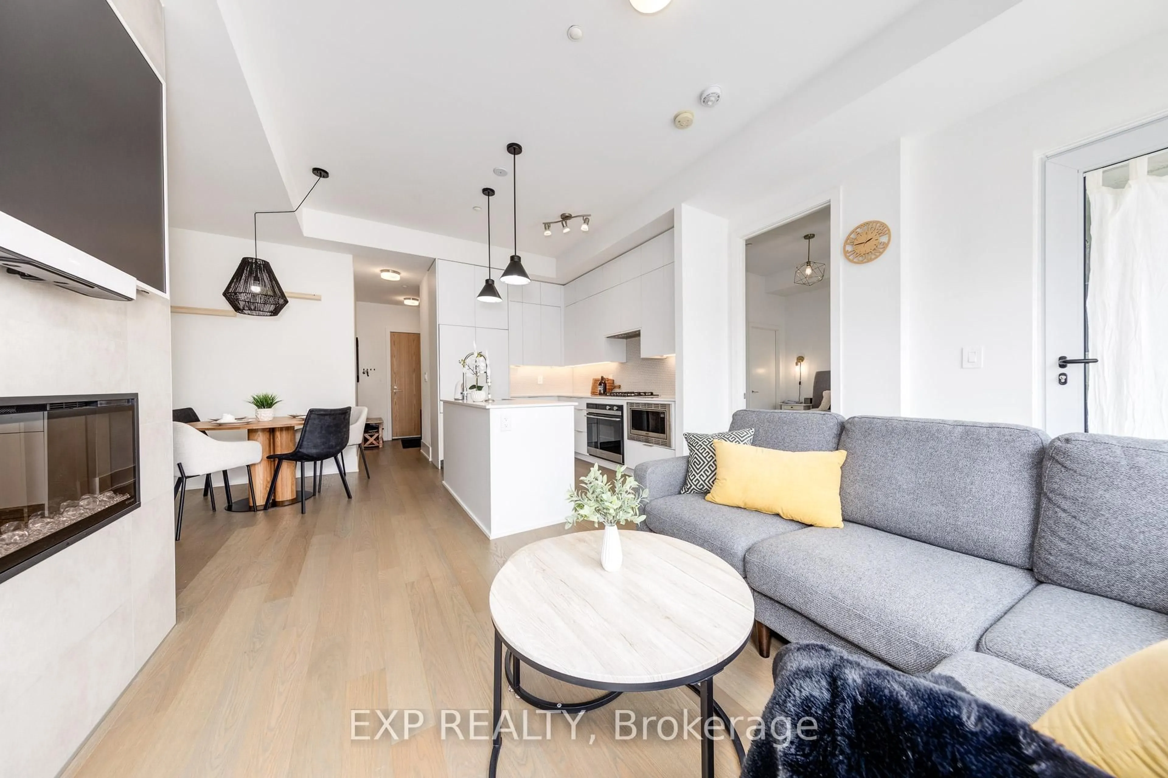 Open concept kitchen, wood/laminate floor for 495 Logan Ave #201, Toronto Ontario M4K 0A5