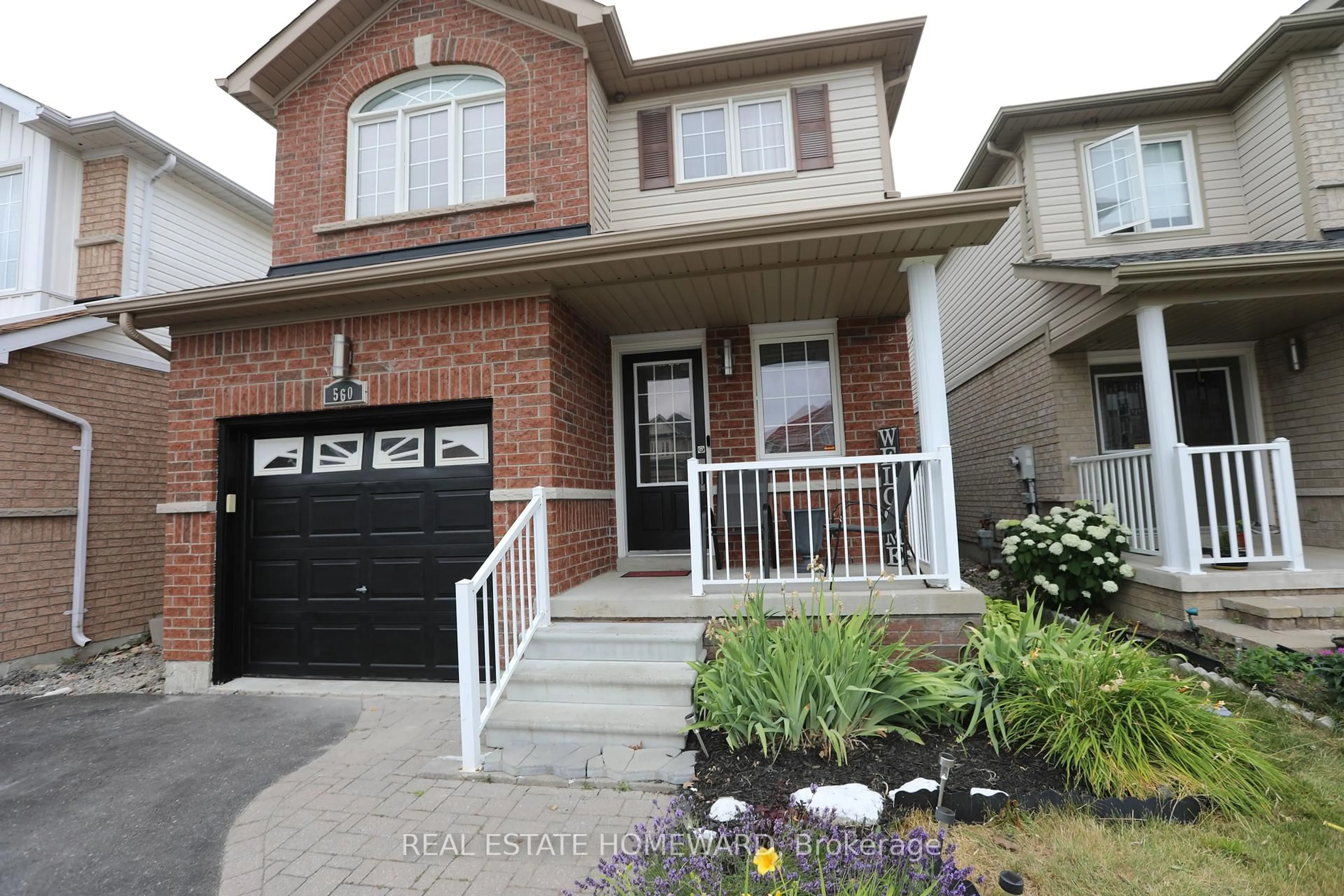 Home with brick exterior material, street for 560 Falconridge Dr, Oshawa Ontario L1K 0C1