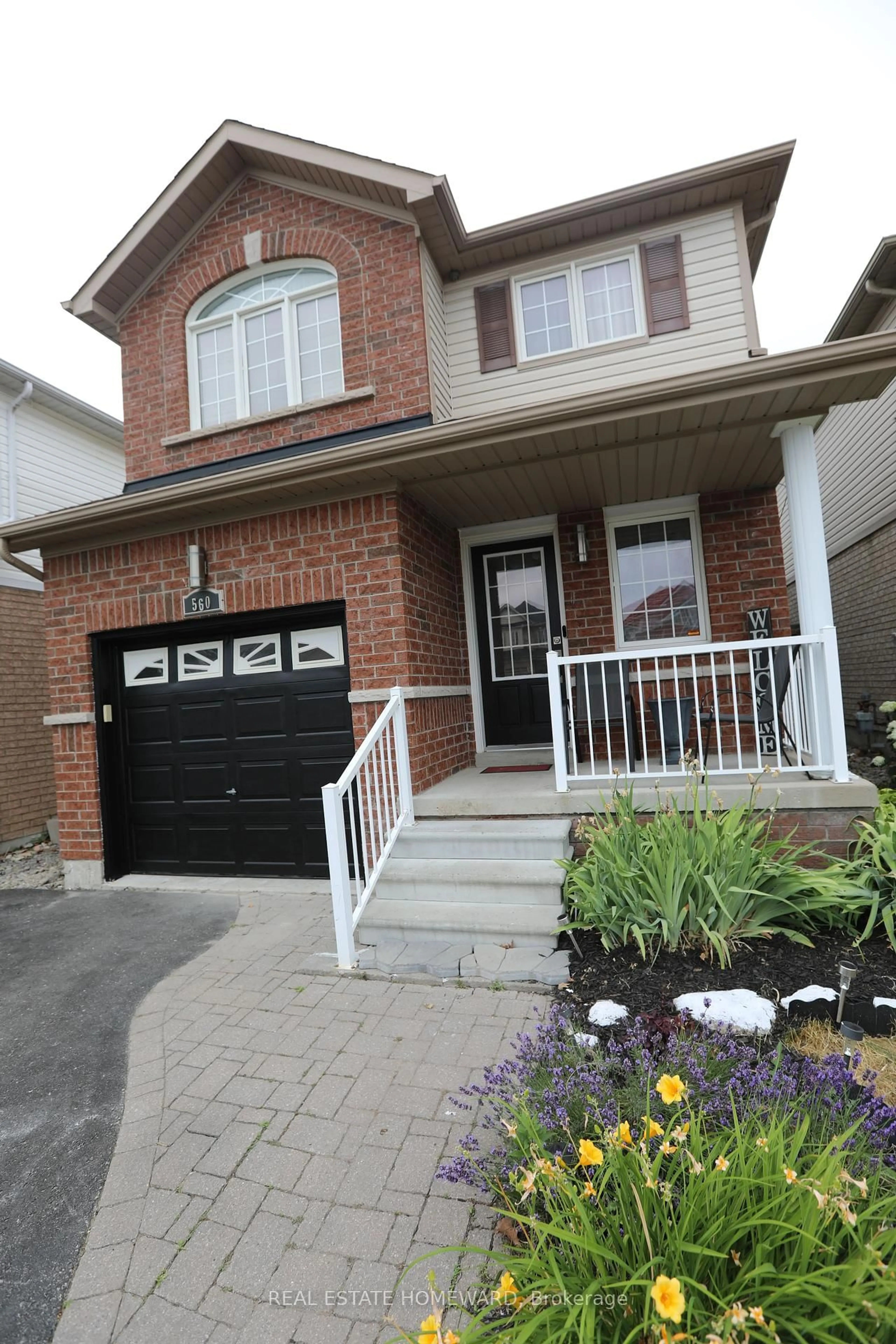 Home with brick exterior material, street for 560 Falconridge Dr, Oshawa Ontario L1K 0C1