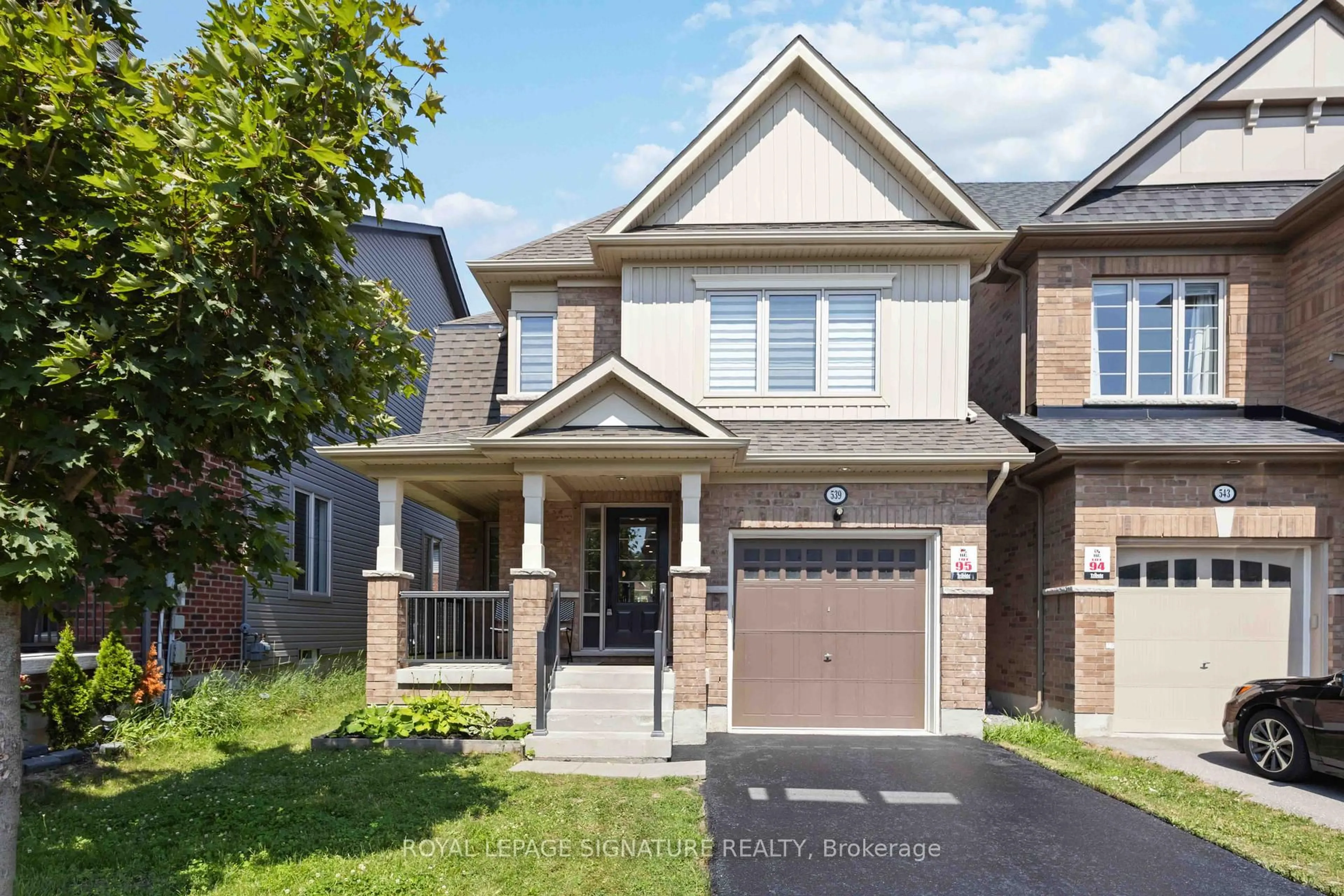 Home with brick exterior material, street for 539 Windfields Farm Dr, Oshawa Ontario L1L 0L7
