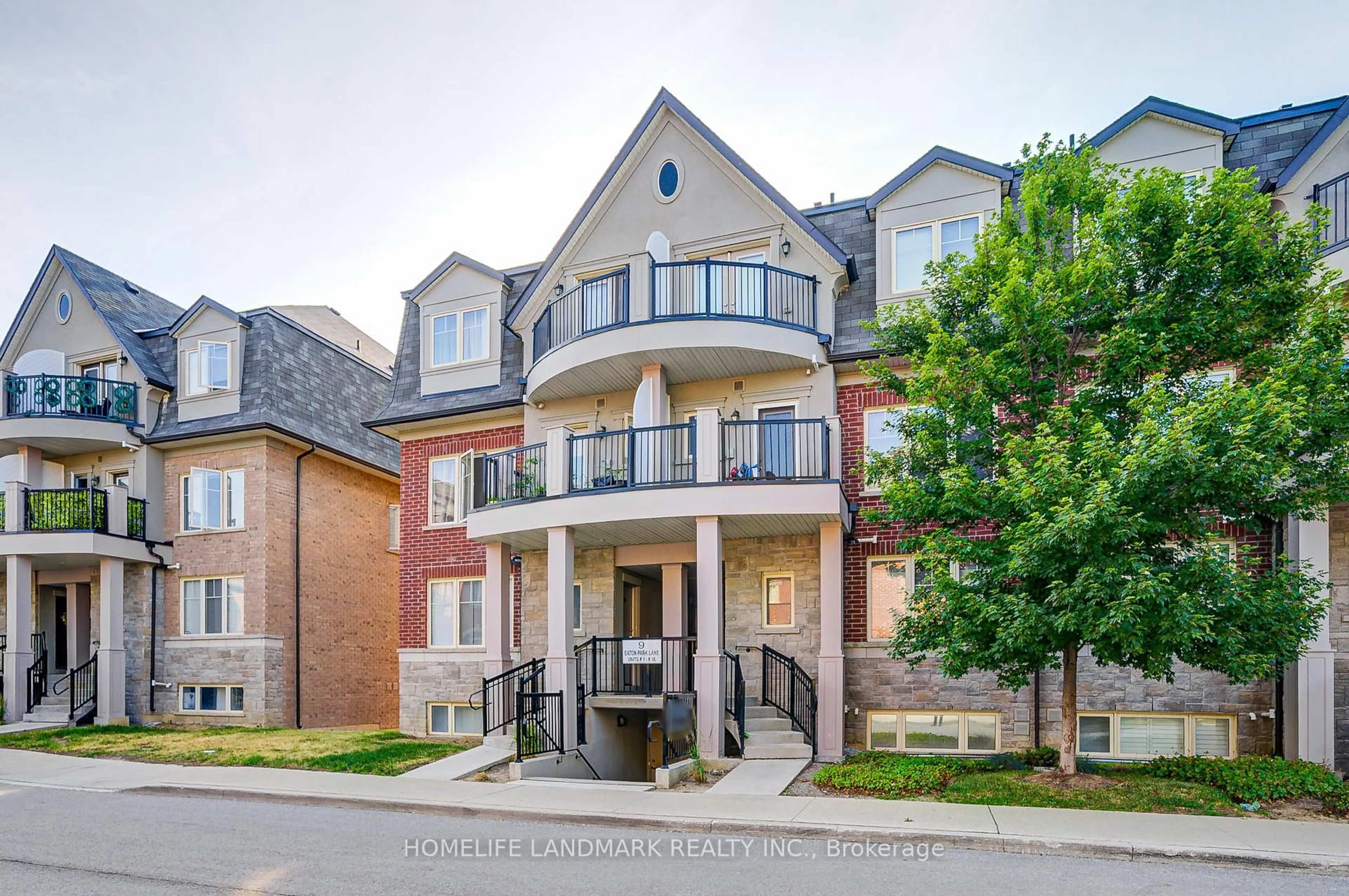 Home with brick exterior material, street for 9 Eaton Park Lane #8, Toronto Ontario M1W 0A5