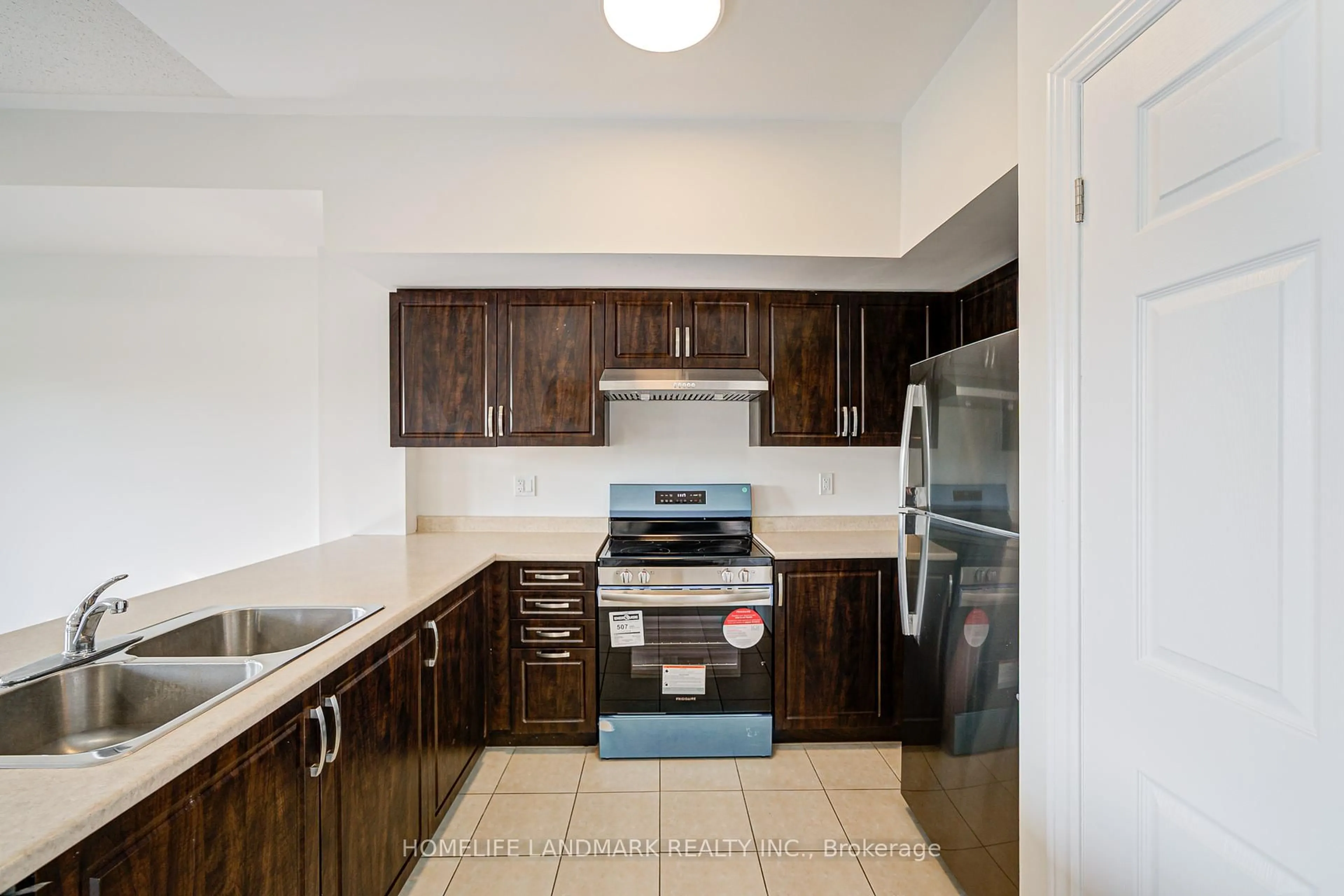 Standard kitchen, ceramic/tile floor for 9 Eaton Park Lane #8, Toronto Ontario M1W 0A5