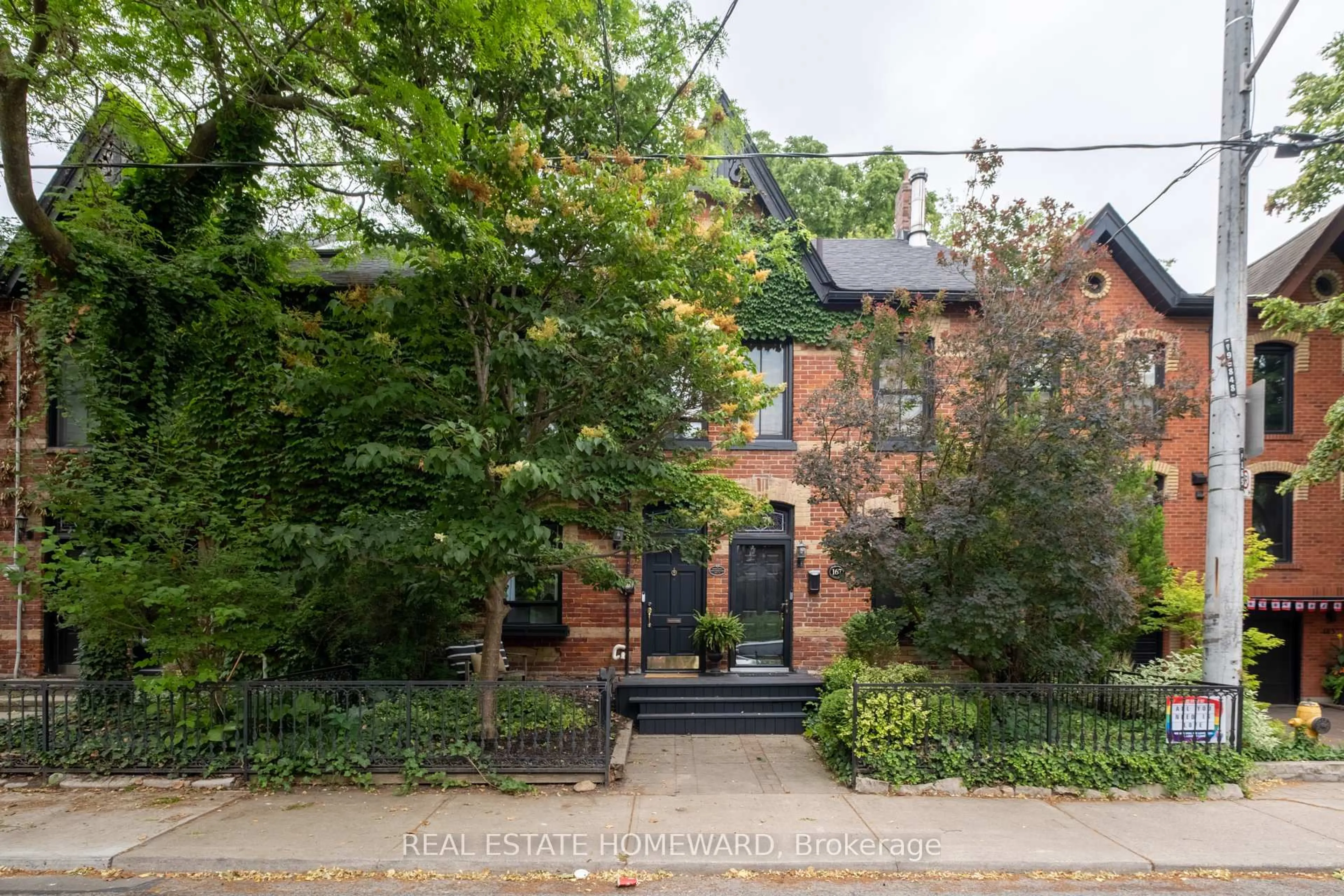 Home with brick exterior material, street for 169 De Grassi St, Toronto Ontario M4M 2K8