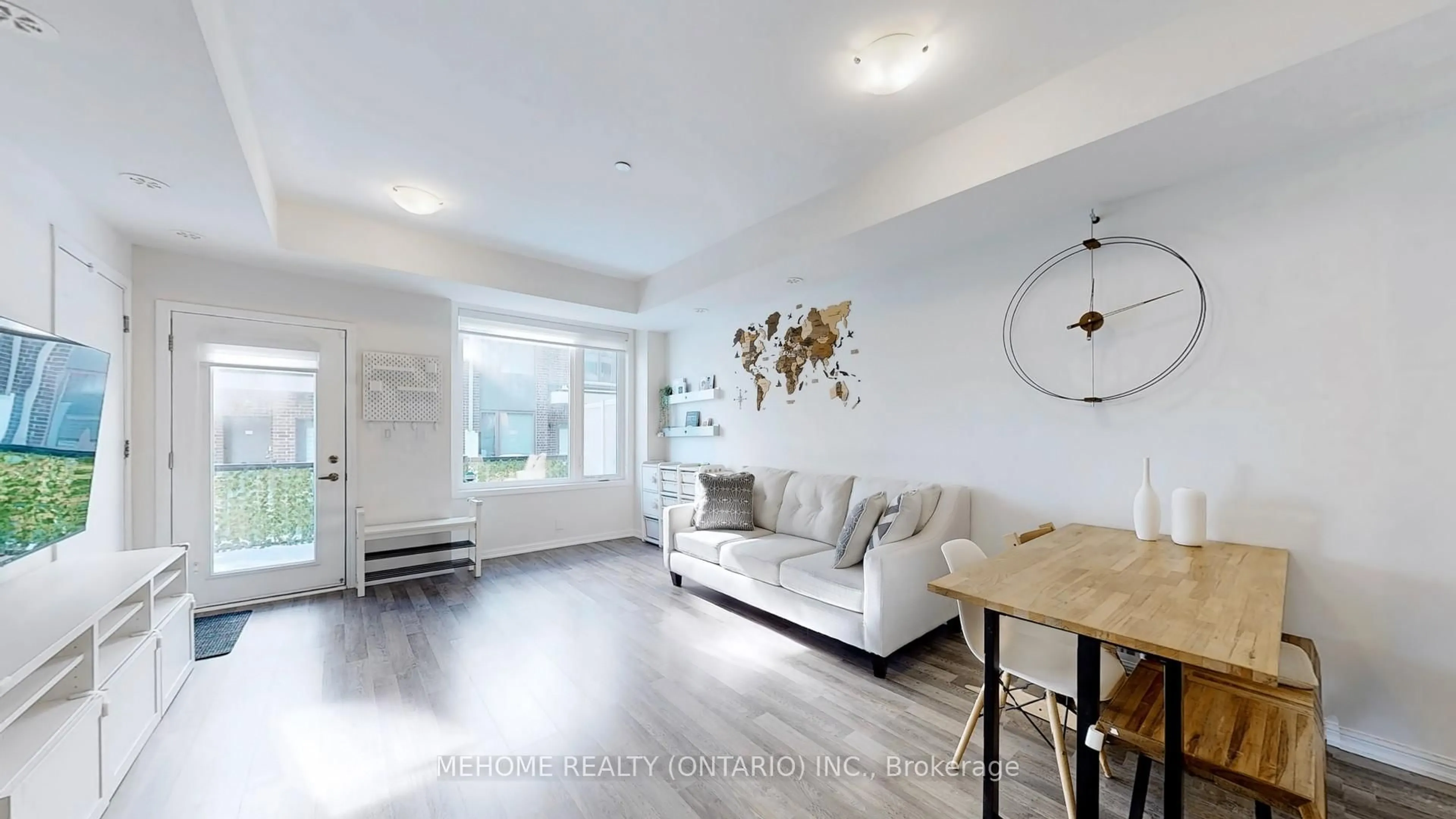 Living room with furniture, wood/laminate floor for 1460 Whites Rd #203, Pickering Ontario L1V 0E8