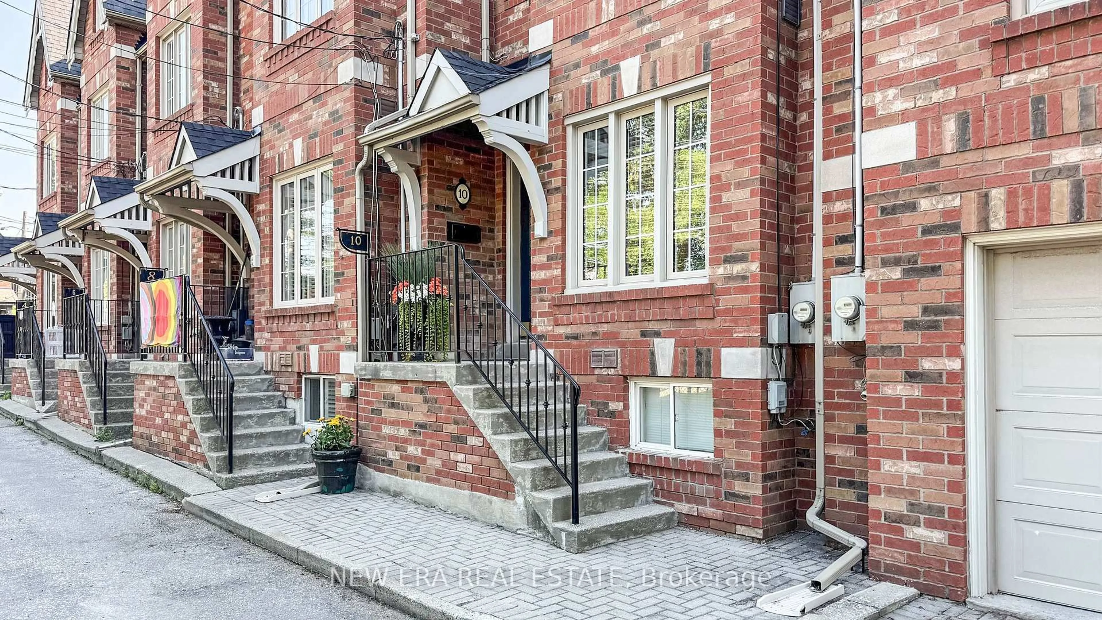 Home with brick exterior material, street for 10 Cam Fella Lane, Toronto Ontario M4L 3Z5