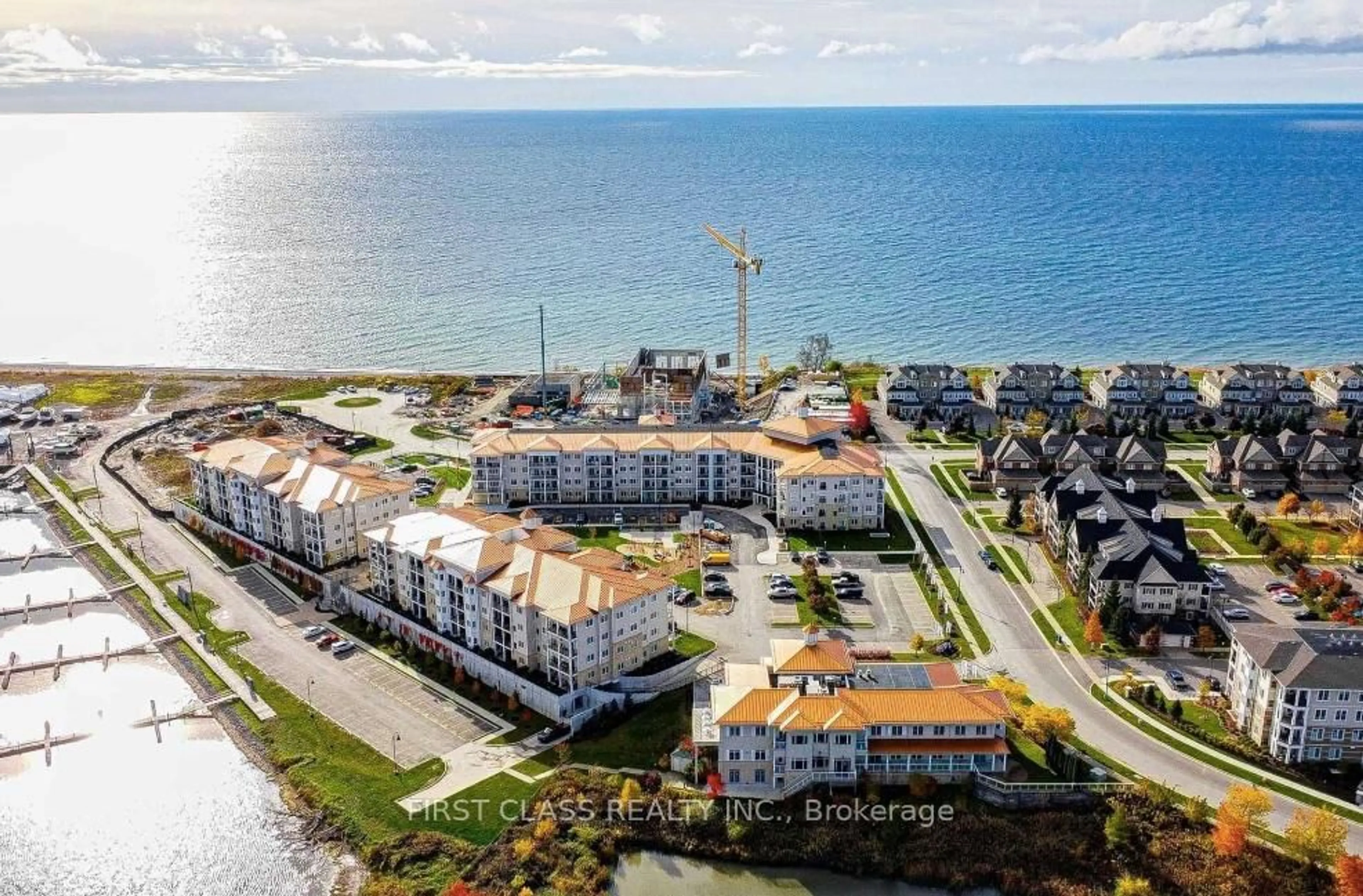 A pic from outside/outdoor area/front of a property/back of a property/a pic from drone, water/lake/river/ocean view for 50 Lakebreeze Dr #317, Clarington Ontario L1B 0V9