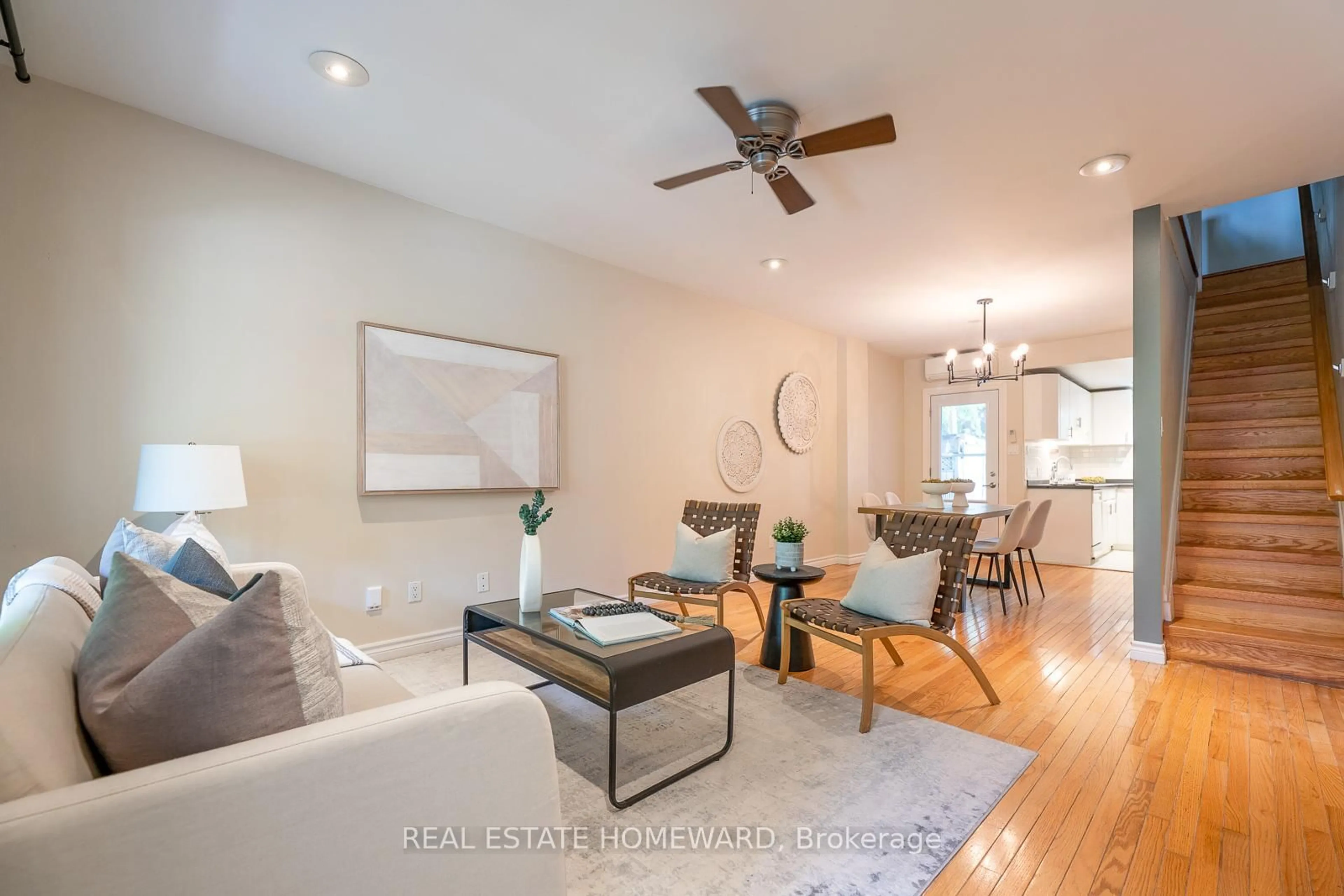 Living room with furniture, wood/laminate floor for 251 Boston Ave, Toronto Ontario M4M 2V1