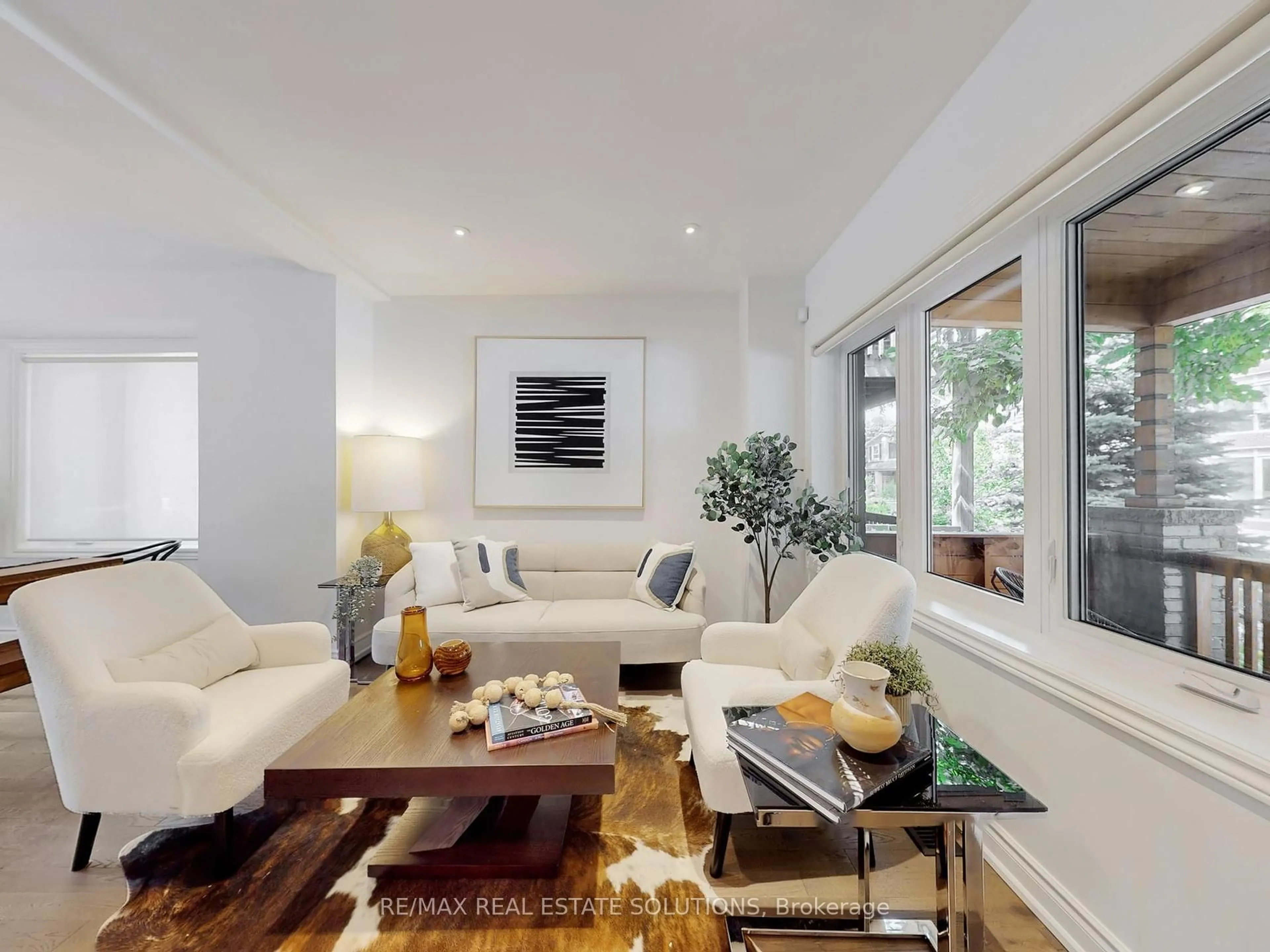 Living room with furniture, wood/laminate floor for 114 Booth Ave, Toronto Ontario M4M 2M4