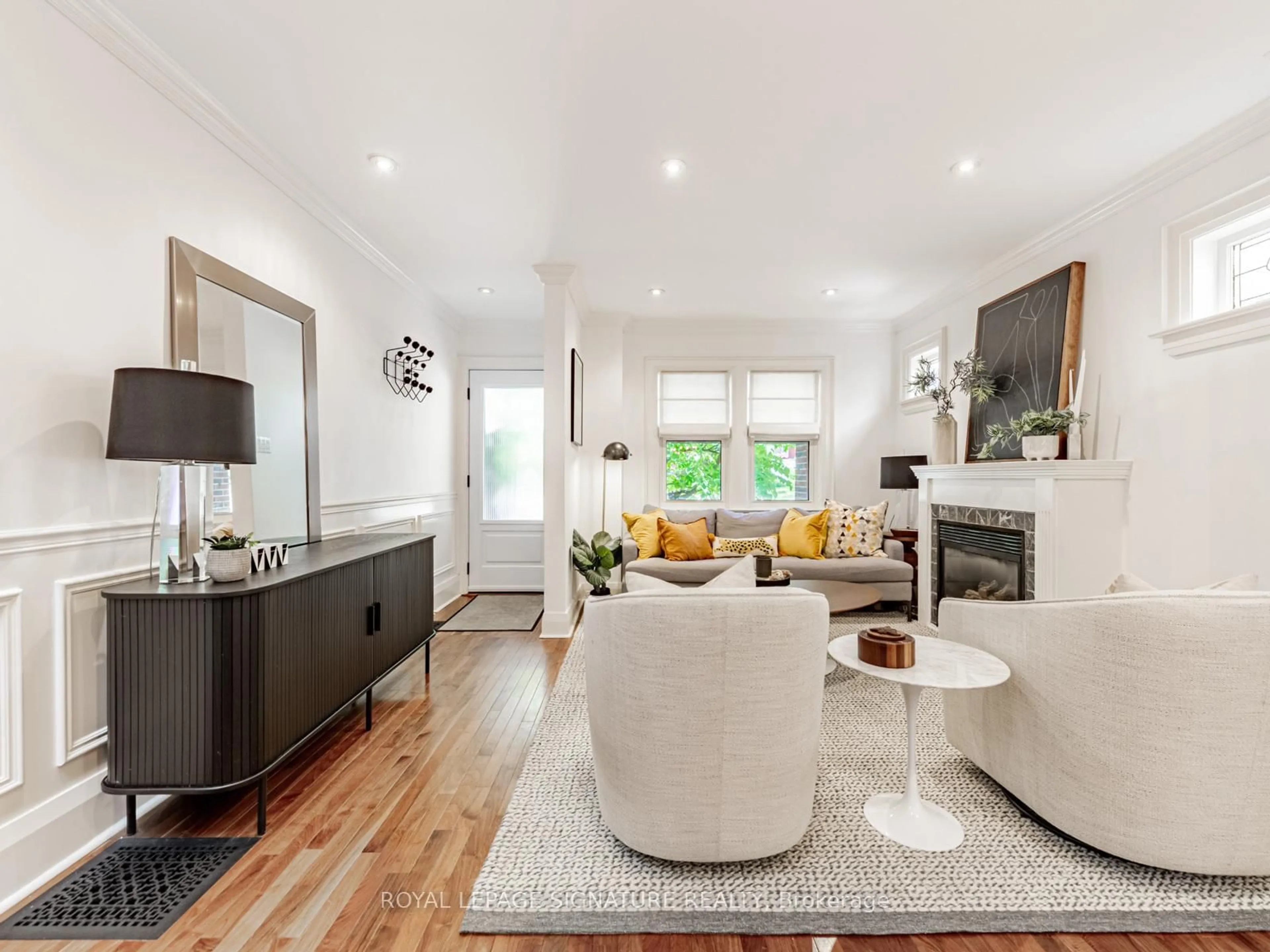 Living room with furniture, wood/laminate floor for 35 Firstbrooke Rd, Toronto Ontario M4E 2L2