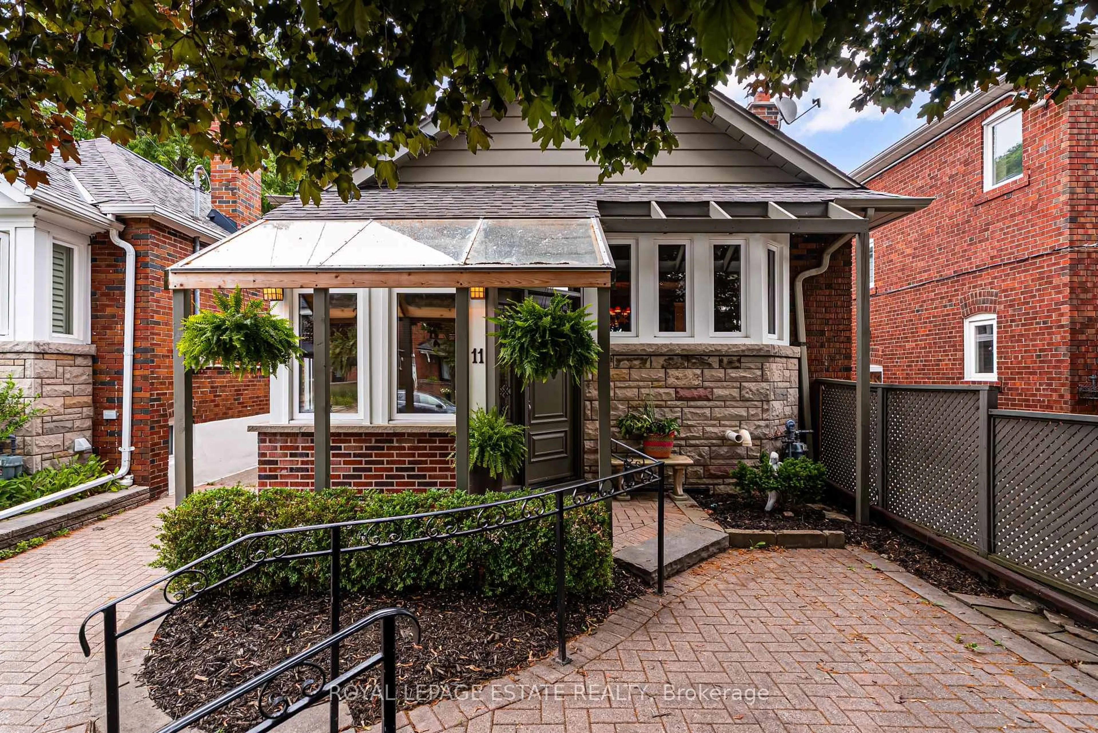 Home with brick exterior material, street for 11 Lankin Blvd, Toronto Ontario M4J 4W7