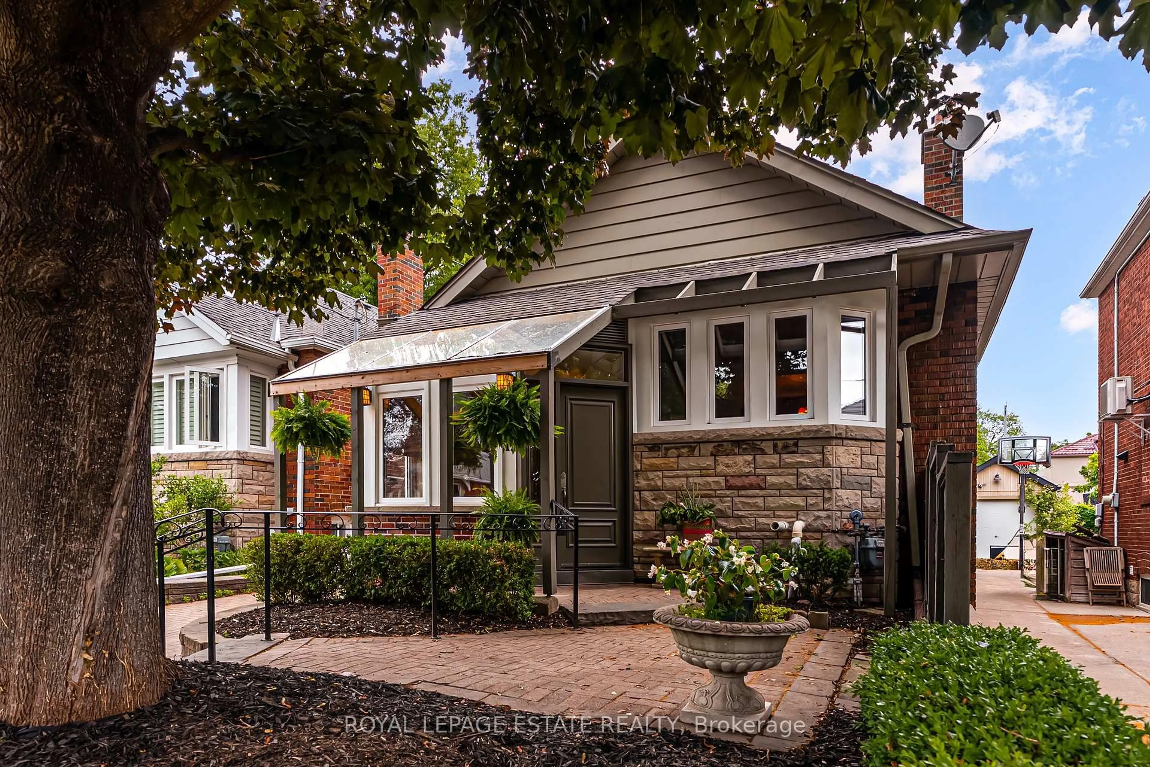 Home with brick exterior material, street for 11 Lankin Blvd, Toronto Ontario M4J 4W7