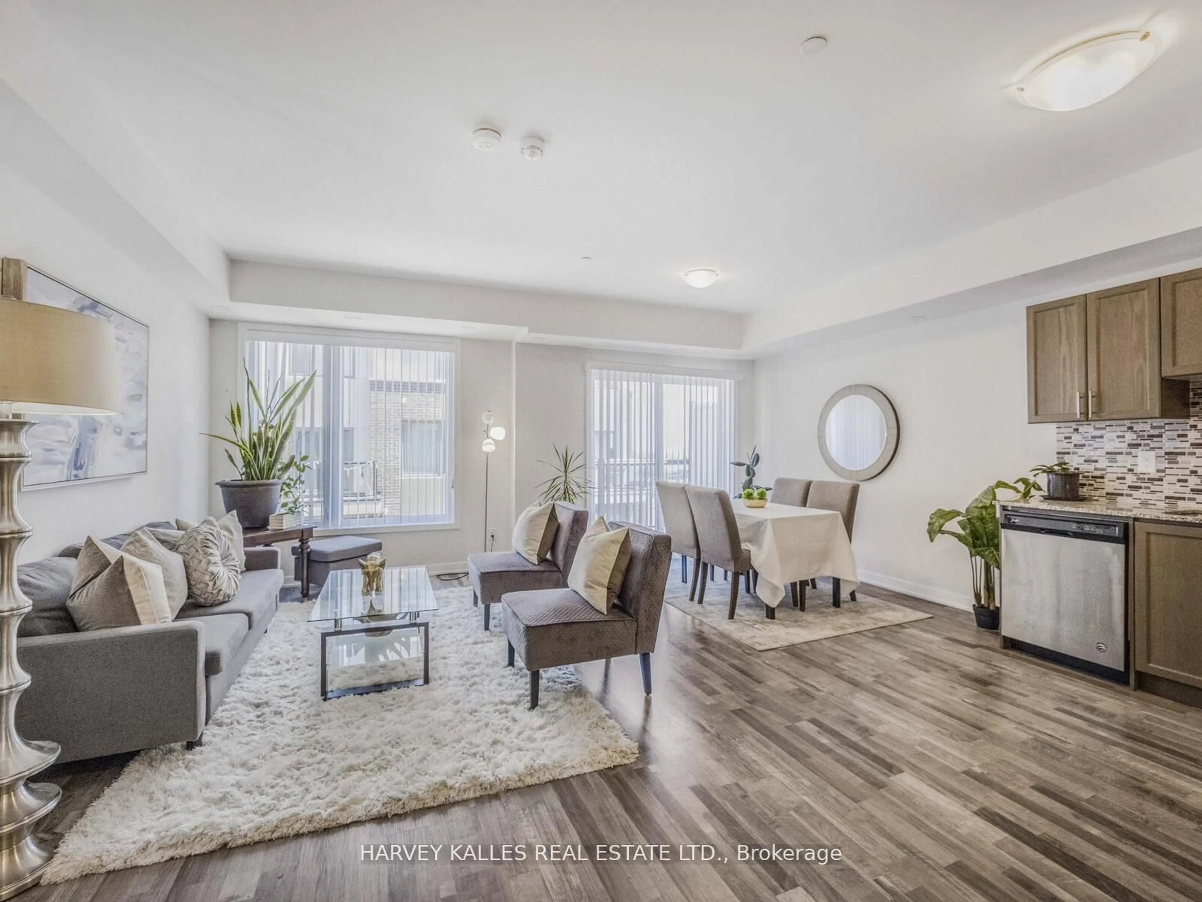 Living room with furniture, wood/laminate floor for 1460 Whites Rd #404, Pickering Ontario L1V 0E8