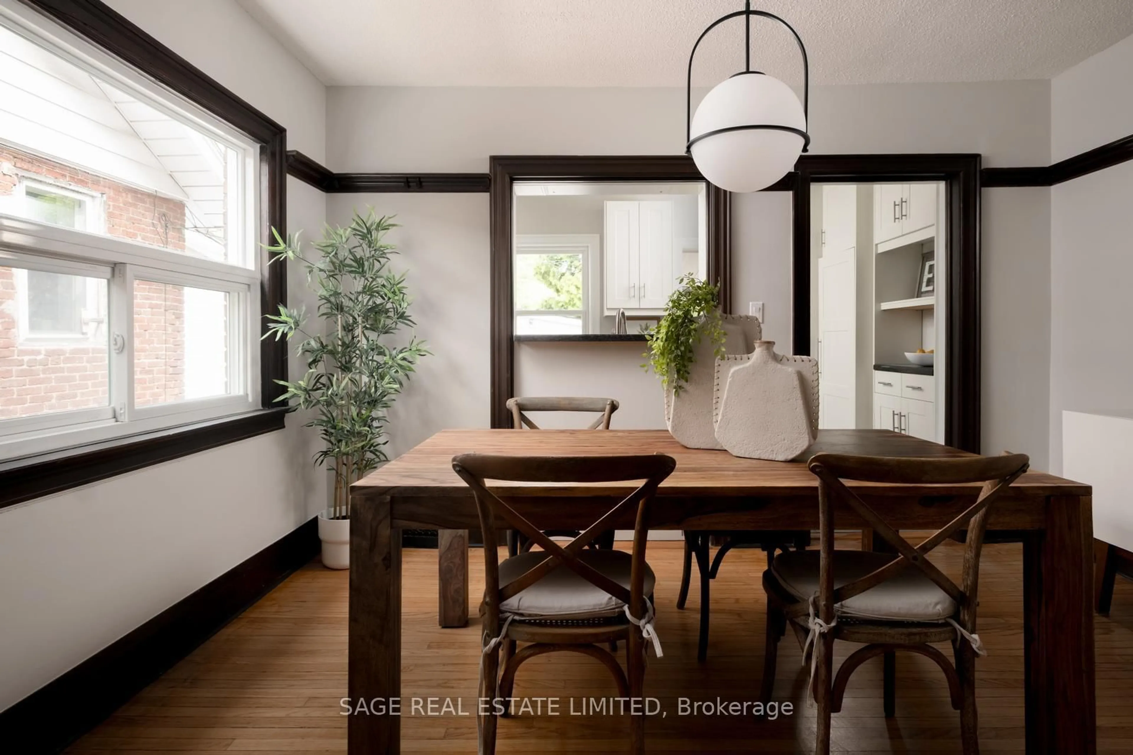 Dining room, wood/laminate floor for 261 Monarch Park Ave, Toronto Ontario M4J 4S6