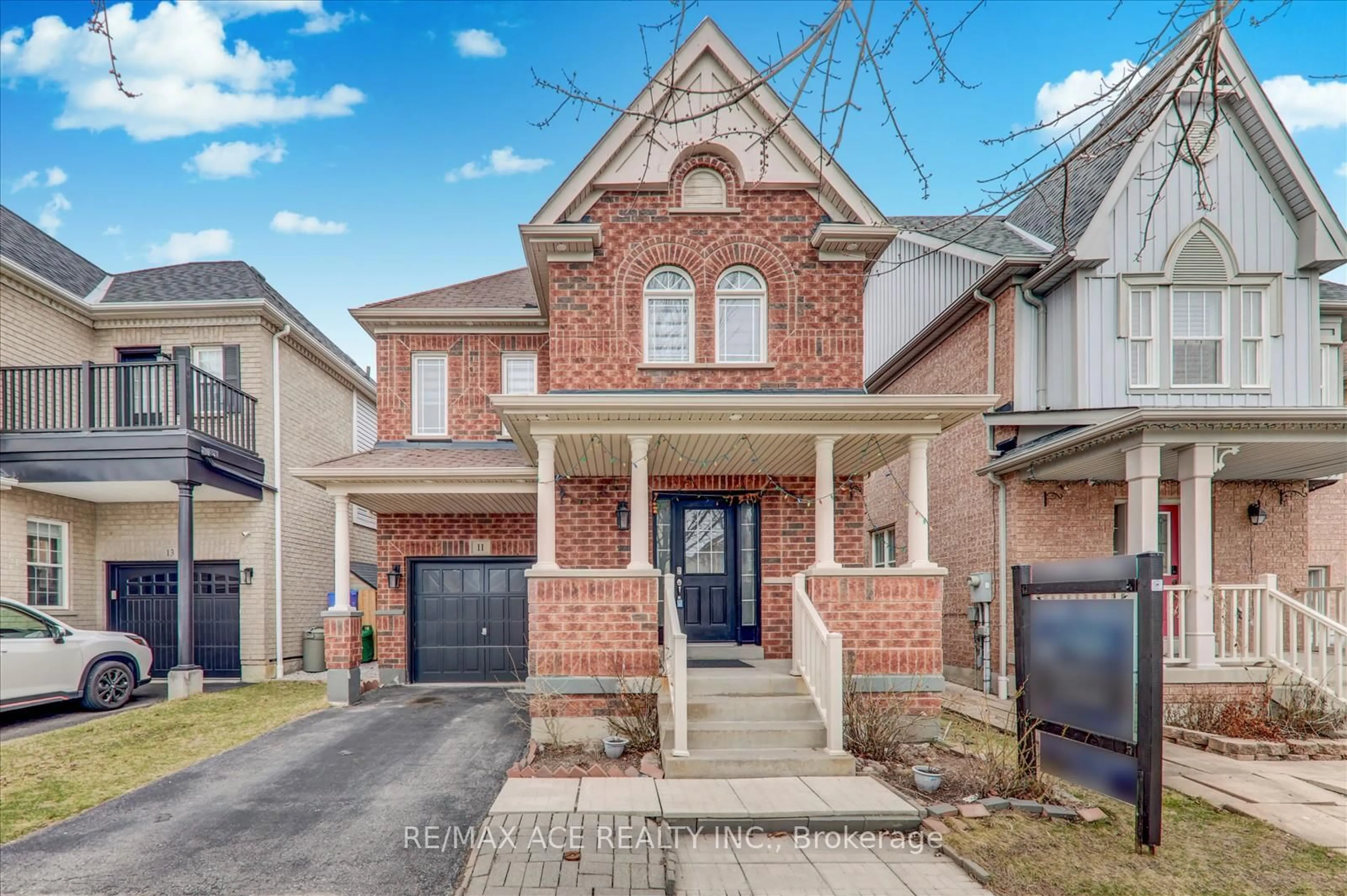 Home with brick exterior material, street for 11 Middlecote Dr, Ajax Ontario L1T 0A4