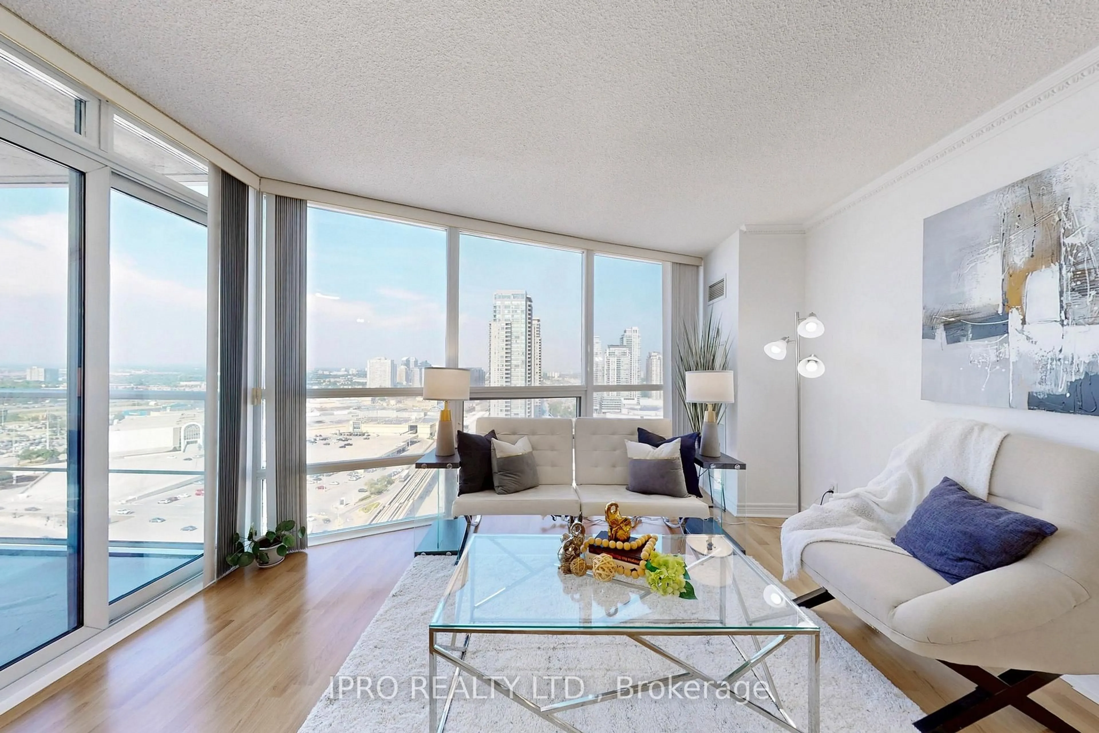 Living room with furniture, wood/laminate floor for 83 Borough Dr #2106, Toronto Ontario M1P 5E4