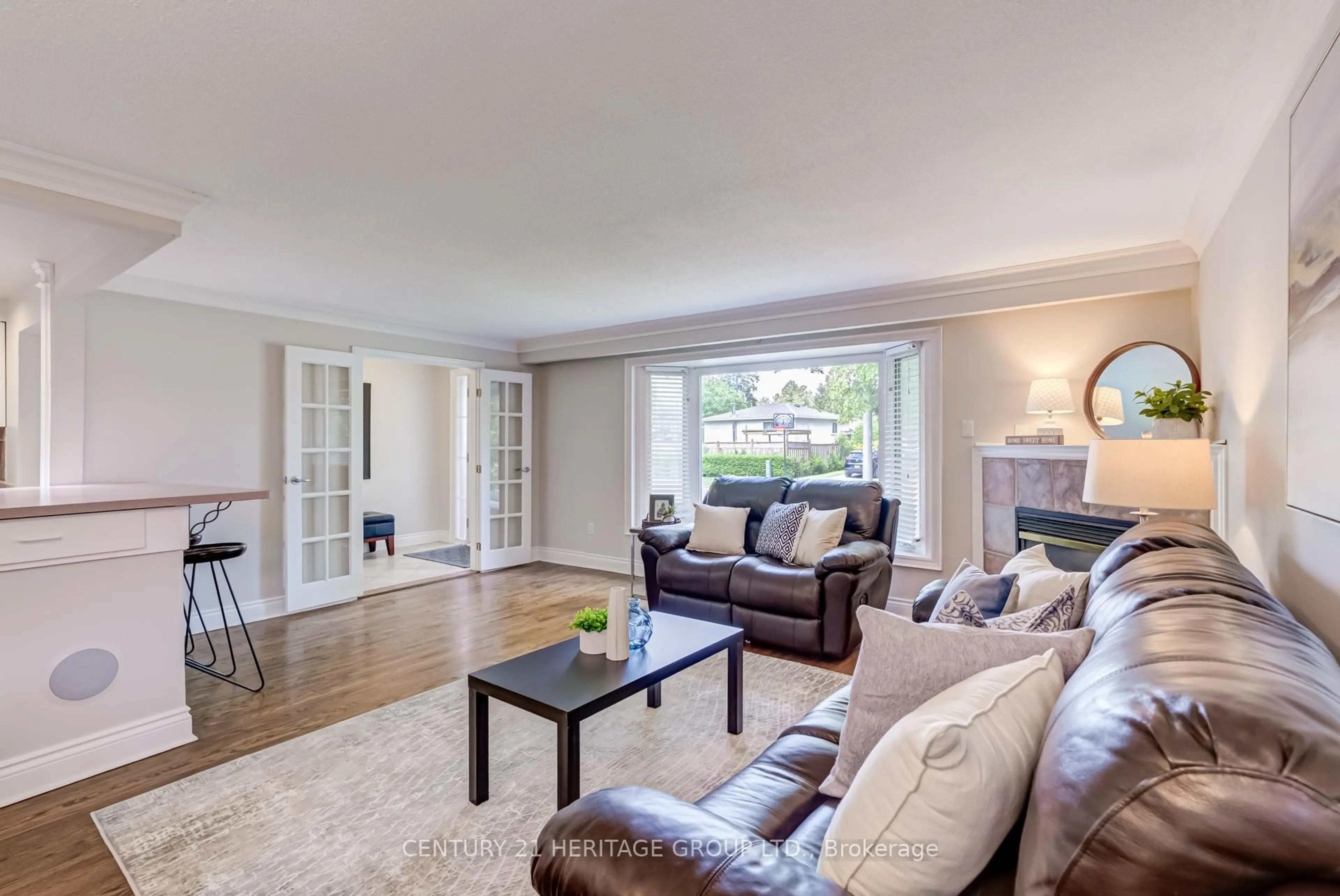 Living room with furniture, wood/laminate floor for 17 Cowling Cres, Ajax Ontario L1S 2Z6