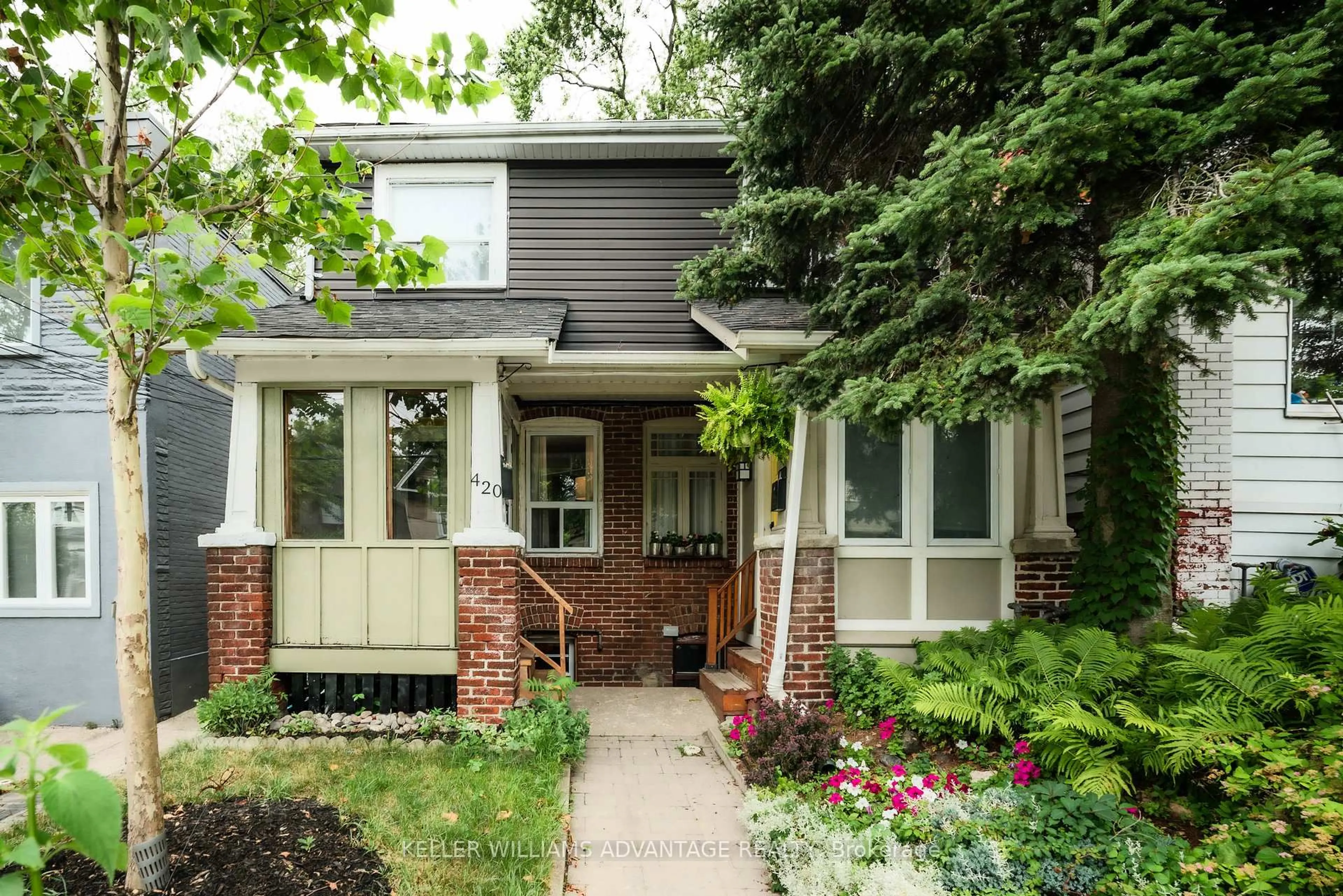 Home with brick exterior material, street for 420 Rhodes Ave, Toronto Ontario M4L 3A5