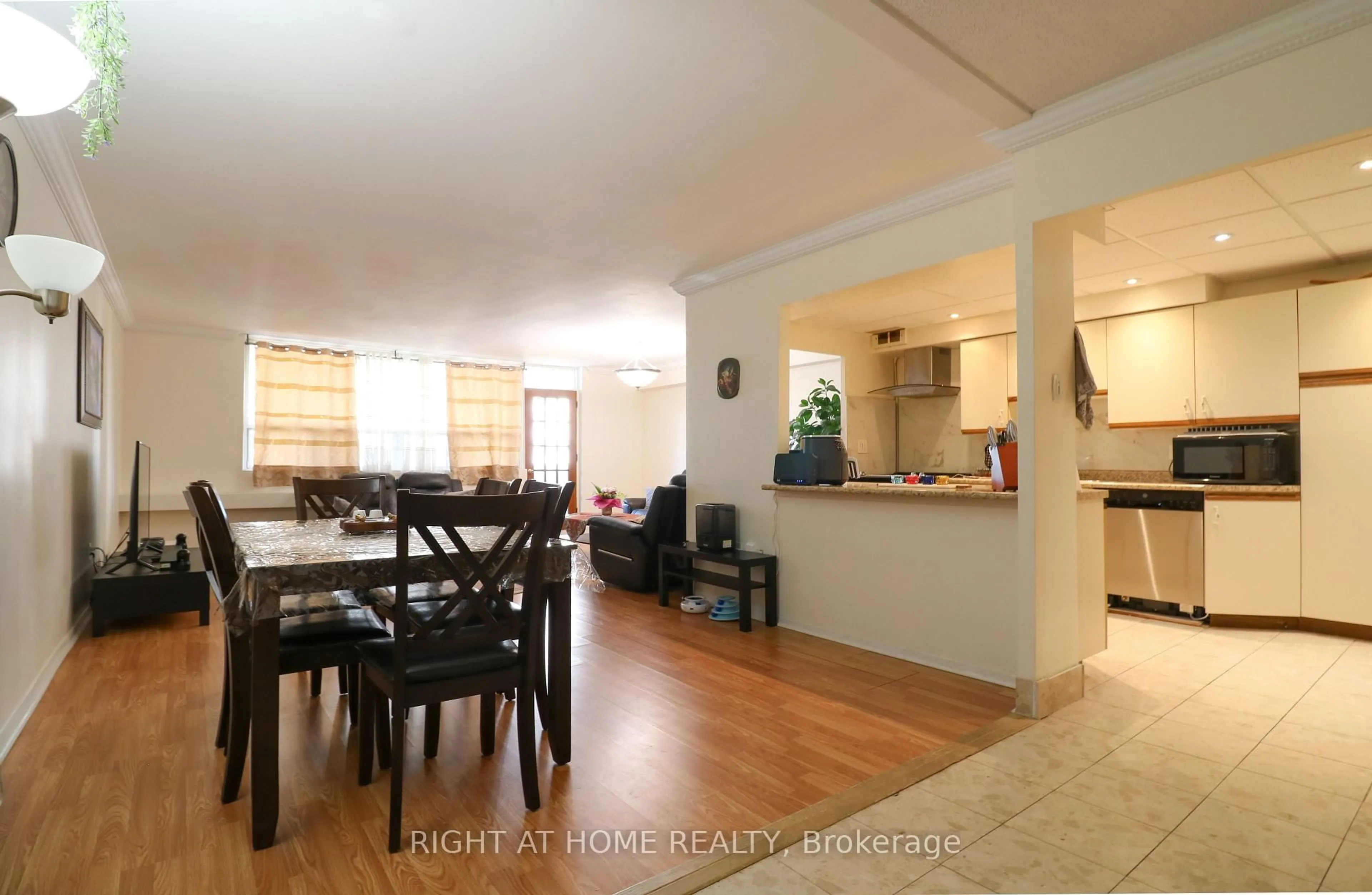 Dining room, wood/laminate floor for 3420 Eglinton Ave #407, Toronto Ontario M1J 2H9
