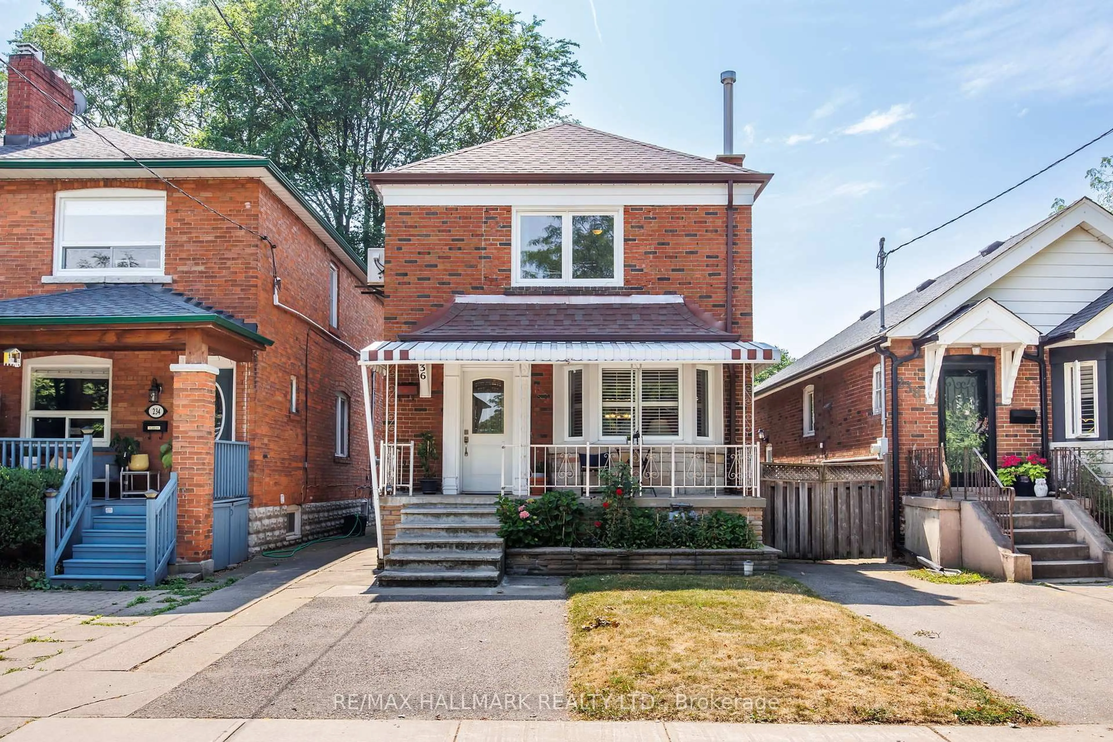 Home with brick exterior material, street for 236 Dewhurst Blvd, Toronto Ontario M4J 3K5