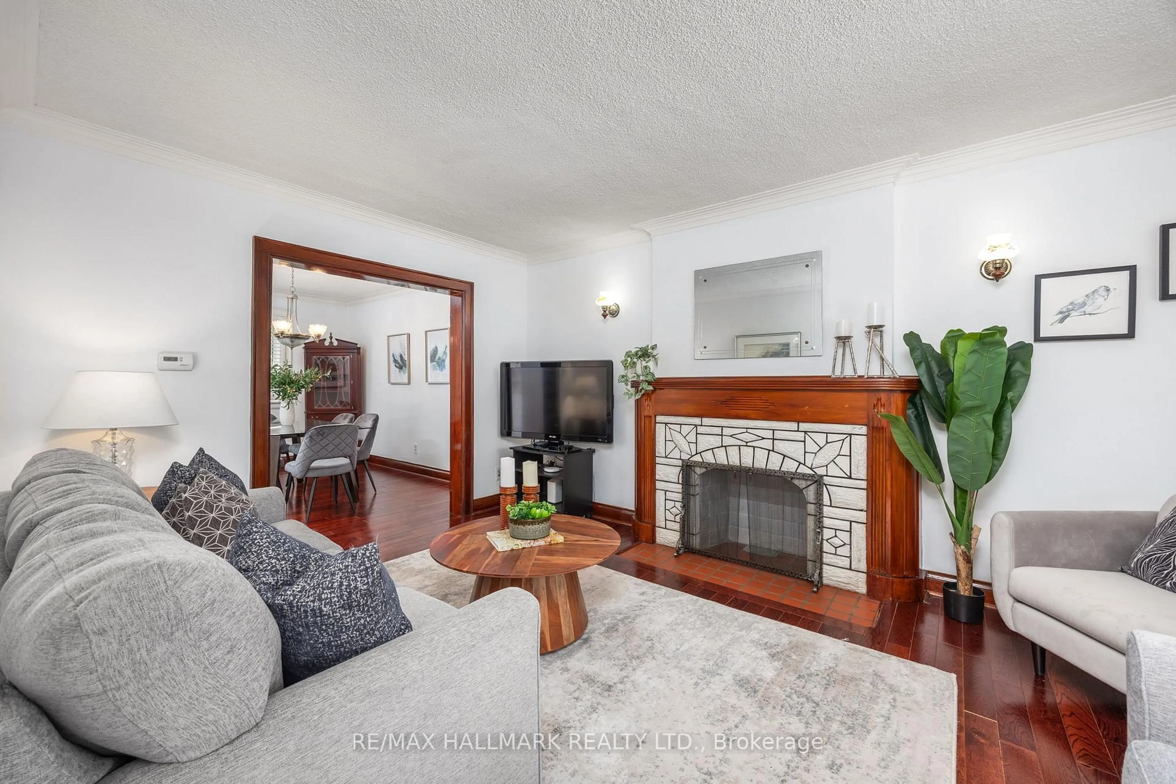 Living room with furniture, unknown for 236 Dewhurst Blvd, Toronto Ontario M4J 3K5