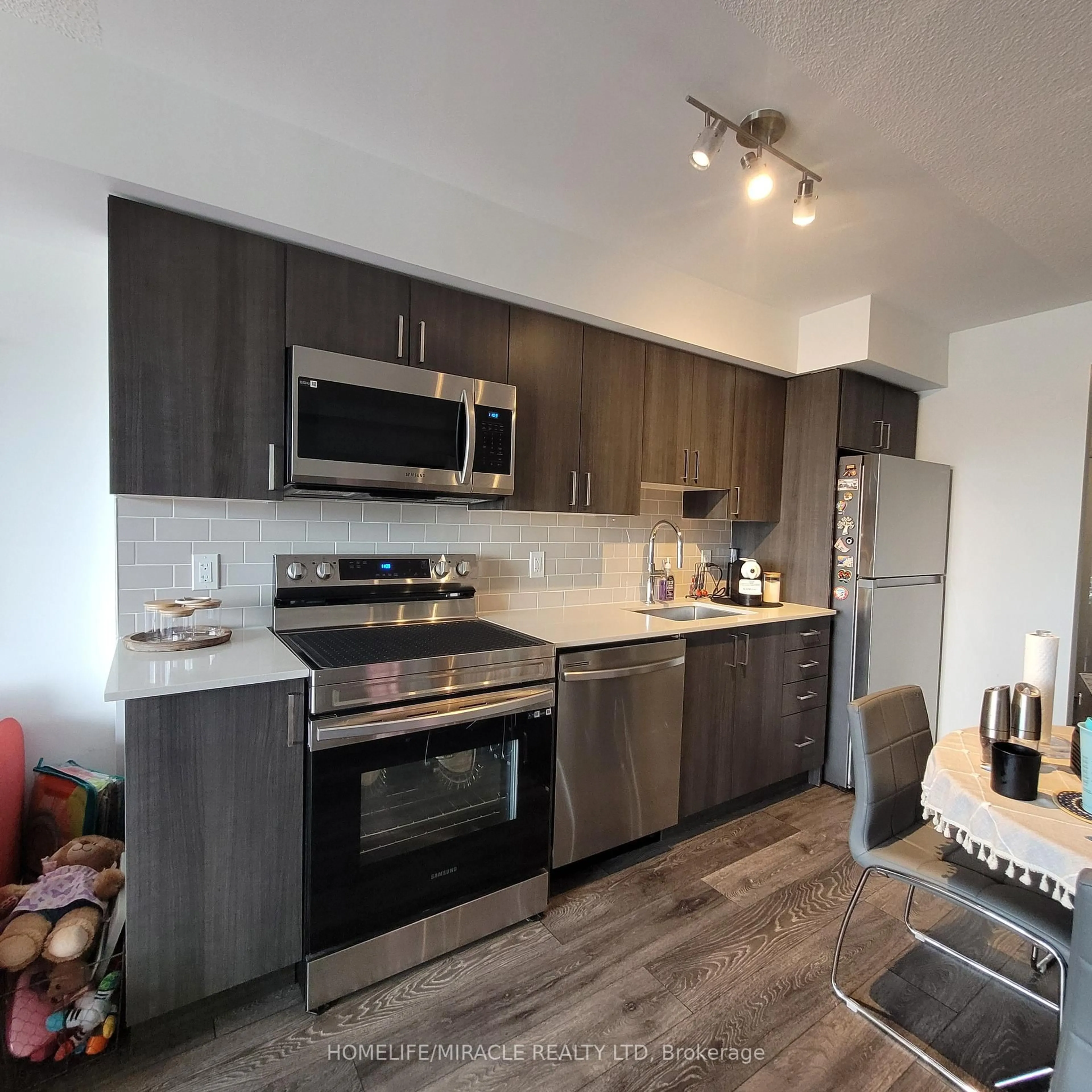 Open concept kitchen, unknown for 1455 Celebration Dr #302, Pickering Ontario L1W 1L8