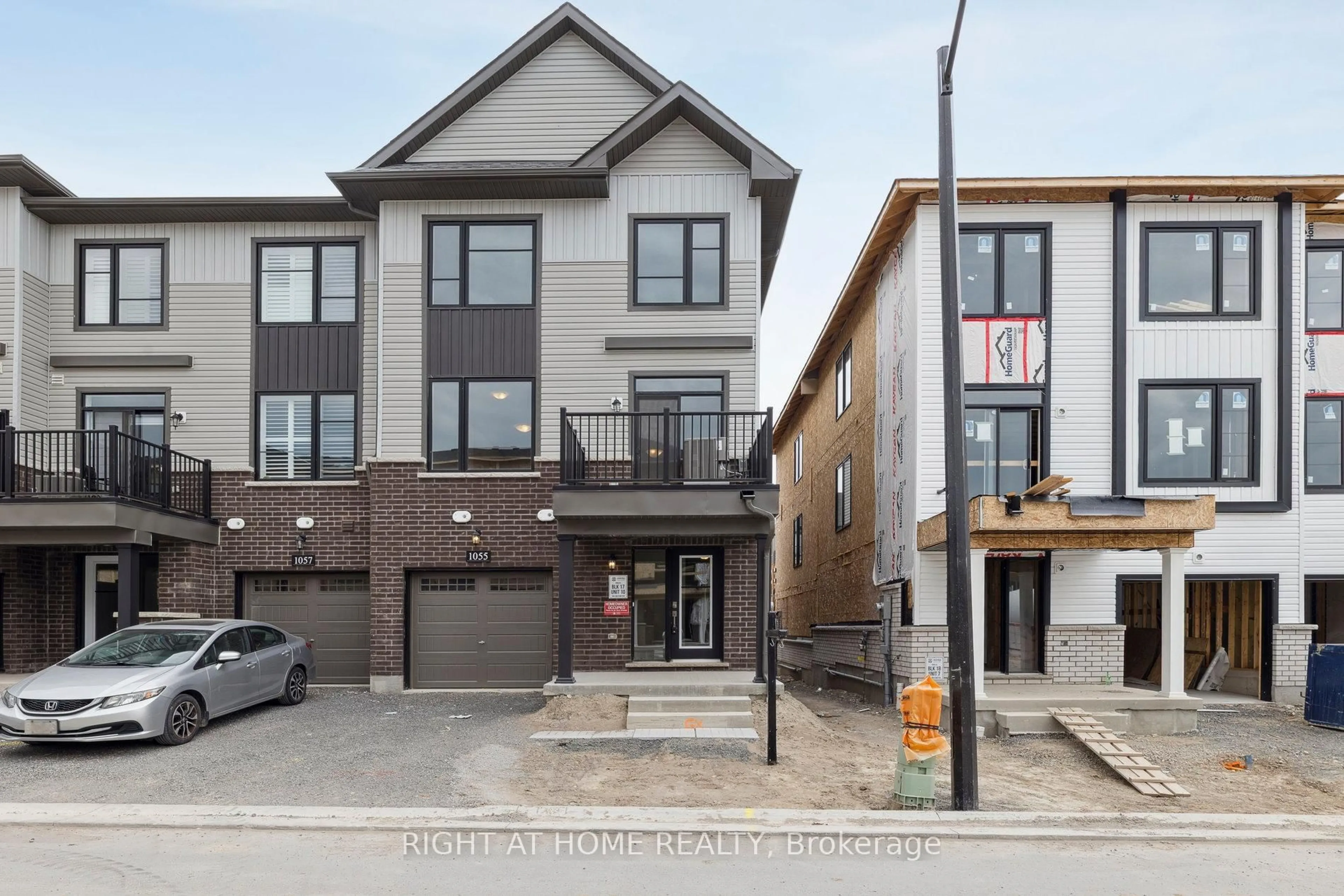 Home with brick exterior material, street for 1055 Honeycomb Path, Oshawa Ontario L1H 8L7