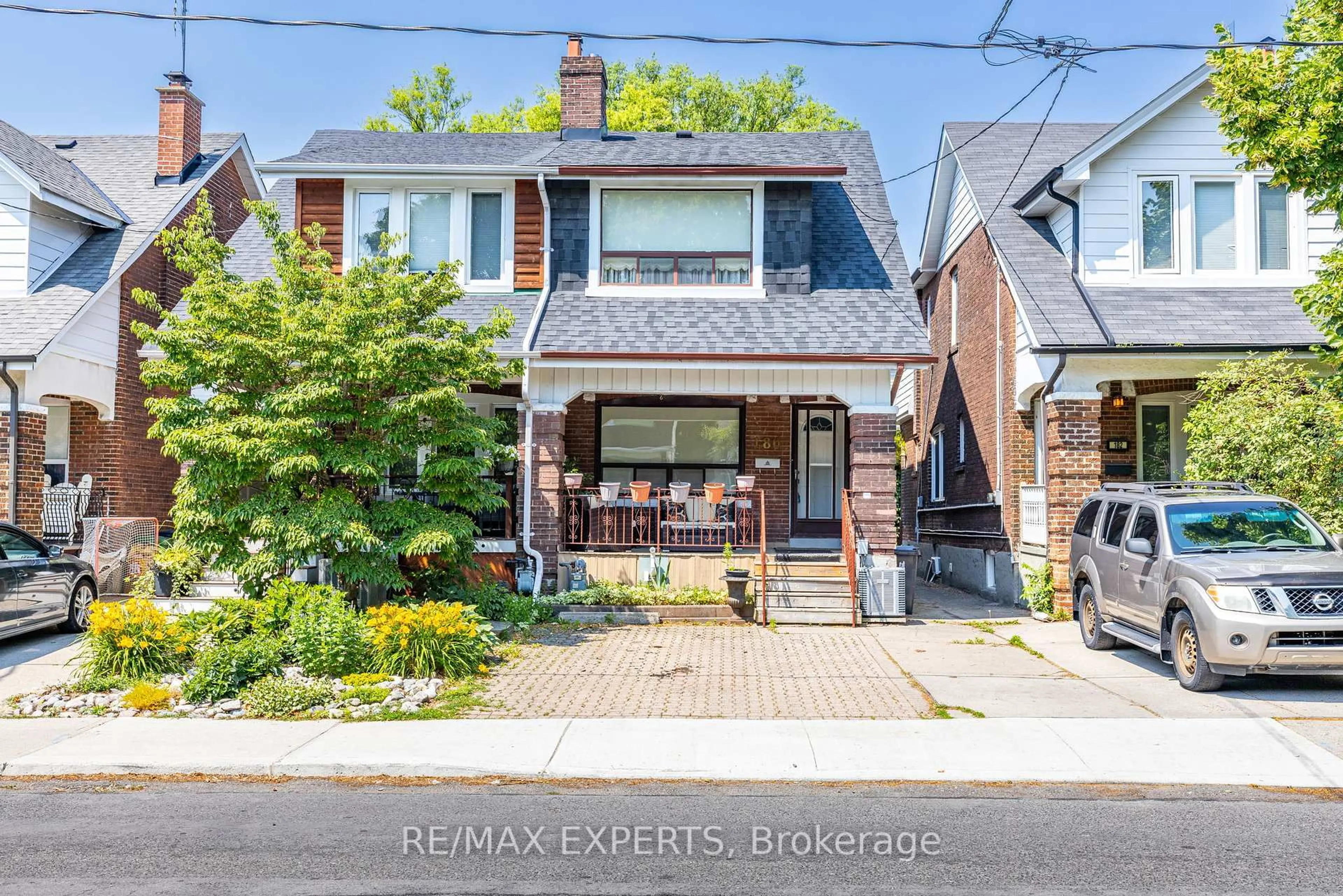 Home with brick exterior material, street for 180 Monarch Park Ave, Toronto Ontario M4J 4R8